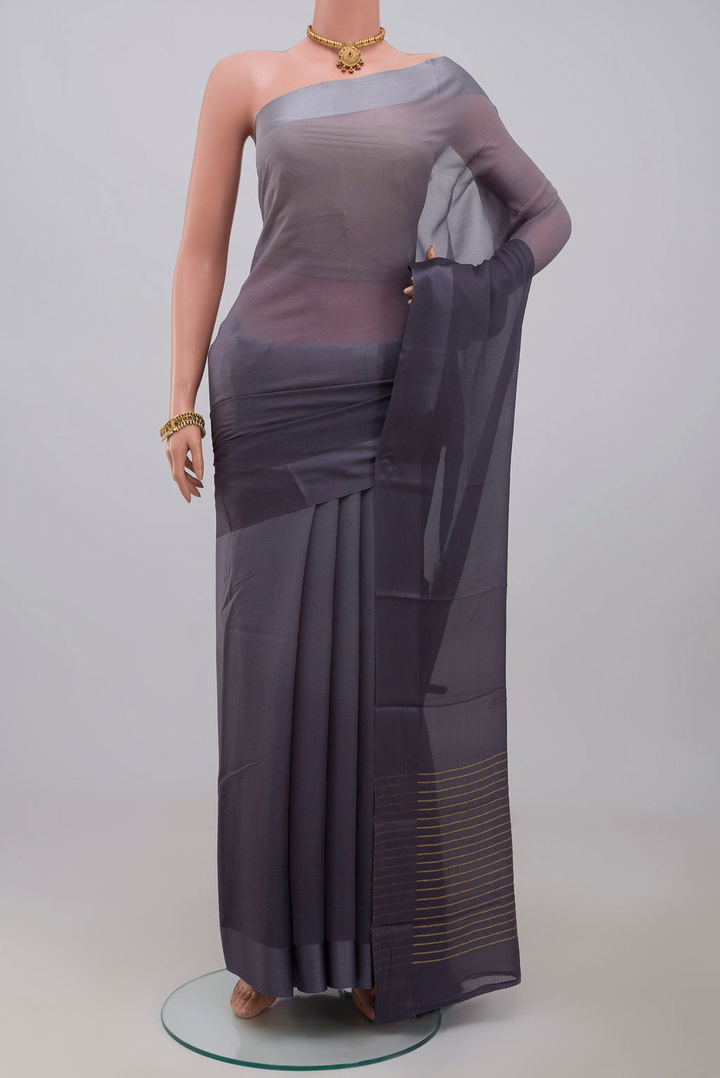 Grey Chiffon Saree with Plain Body and Plain Border.  displayed on a mannequin