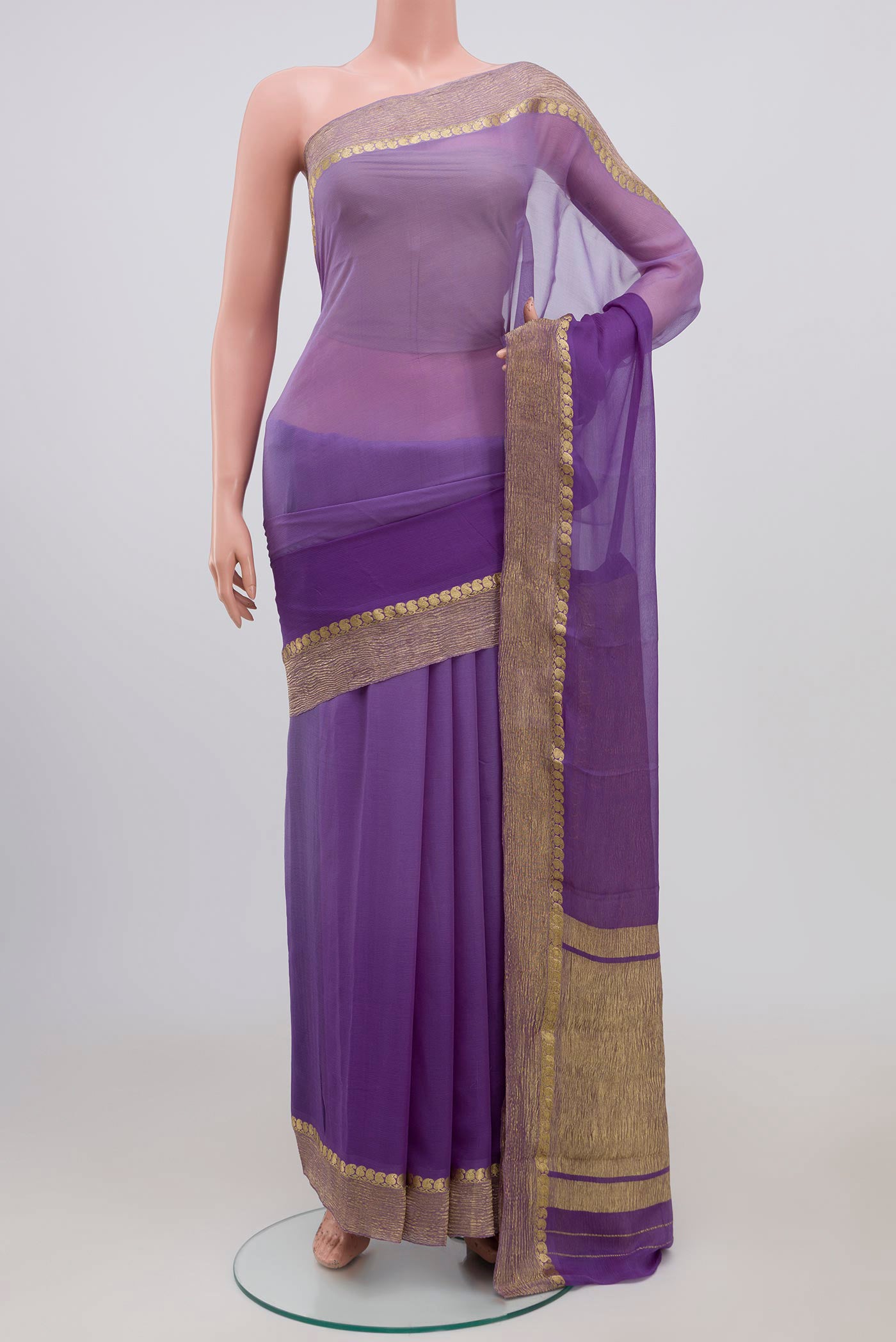 Lavender Chiffon Saree with Plain Body and Zari Border.  displayed on a mannequin