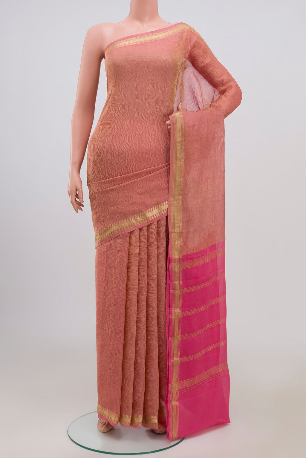 Pink Chiffon Saree with Fancy on the body and Zari Border.  displayed on a mannequin