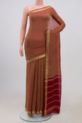 Maroon Chiffon Saree with Fancy on the body and Zari Border.  displayed on a mannequin