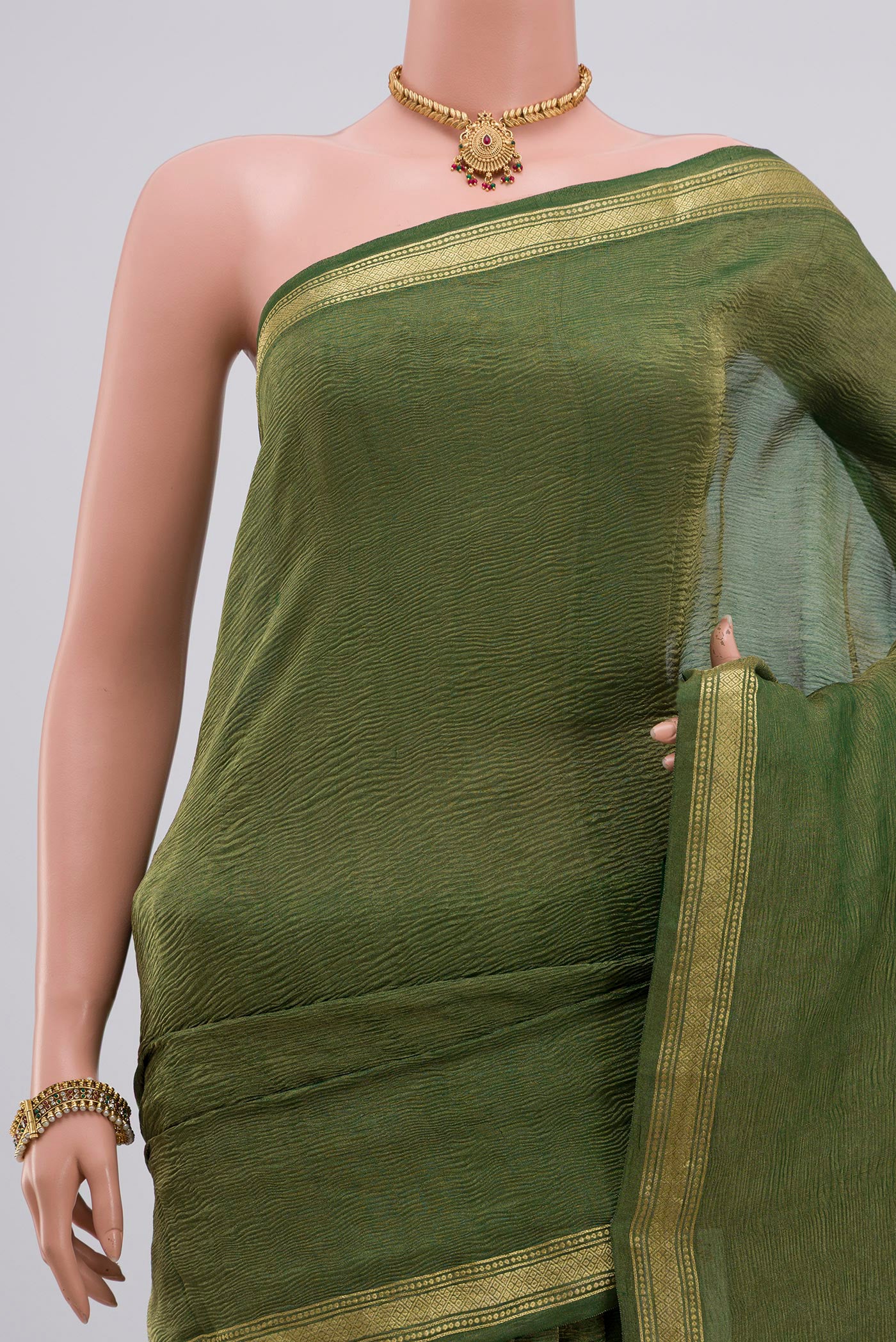 Border image of Green Chiffon Saree with Plain Body and Zari Border. 