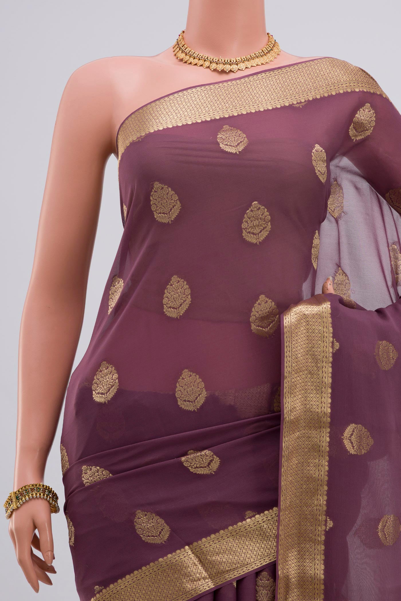 Border image of Lavender Georgette Saree with Fancy on the body and Zari Border. 