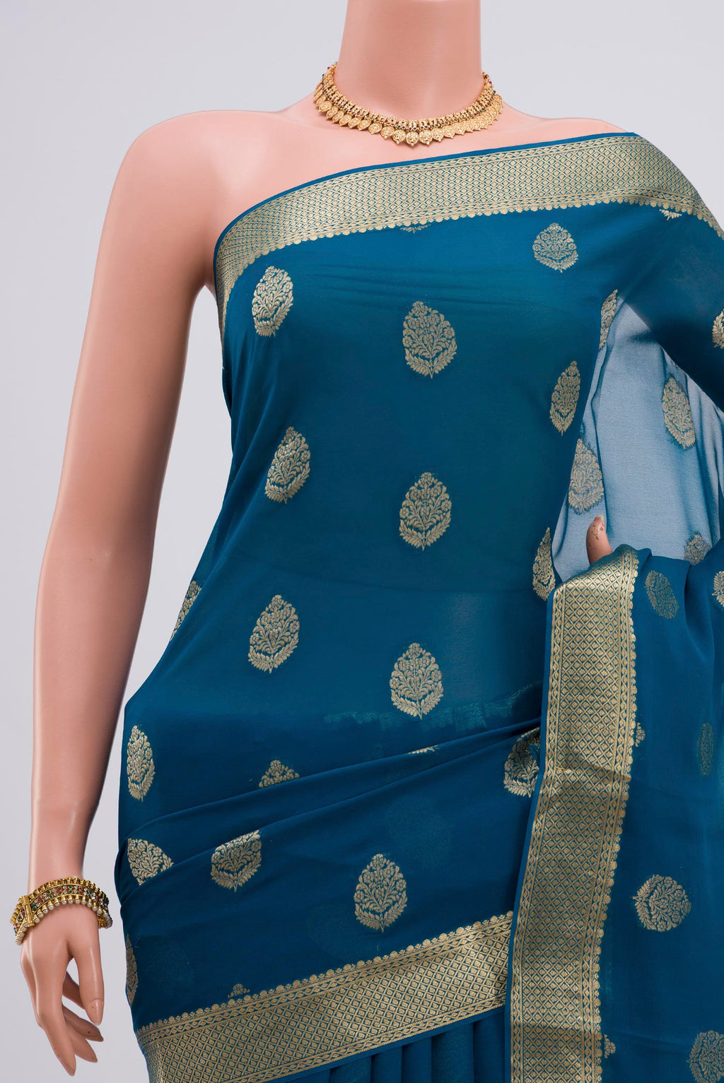 Border image of Blue Georgette Saree with Fancy on the body and Zari Border. 