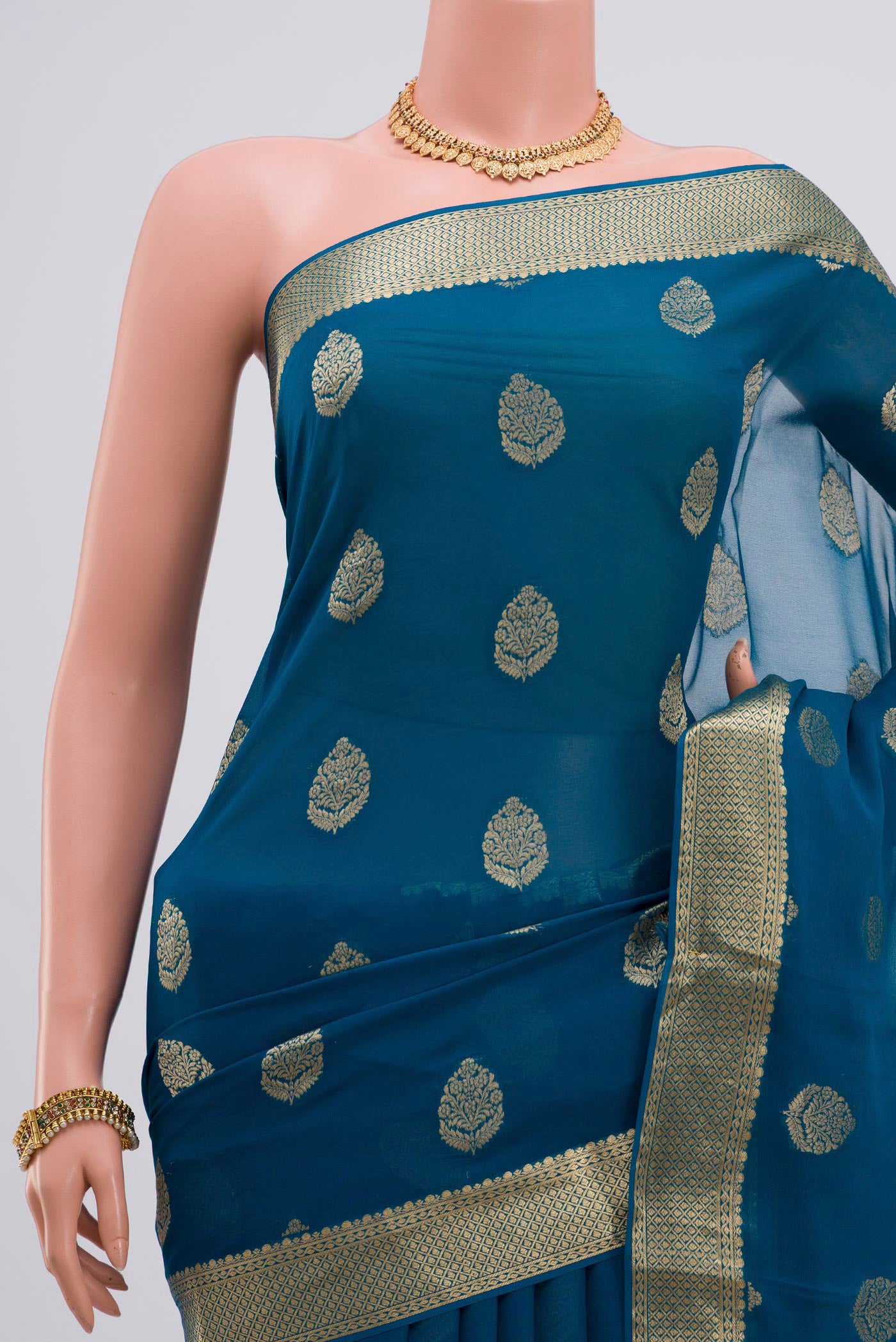 Border image of Blue Georgette Saree with Fancy on the body and Zari Border. 