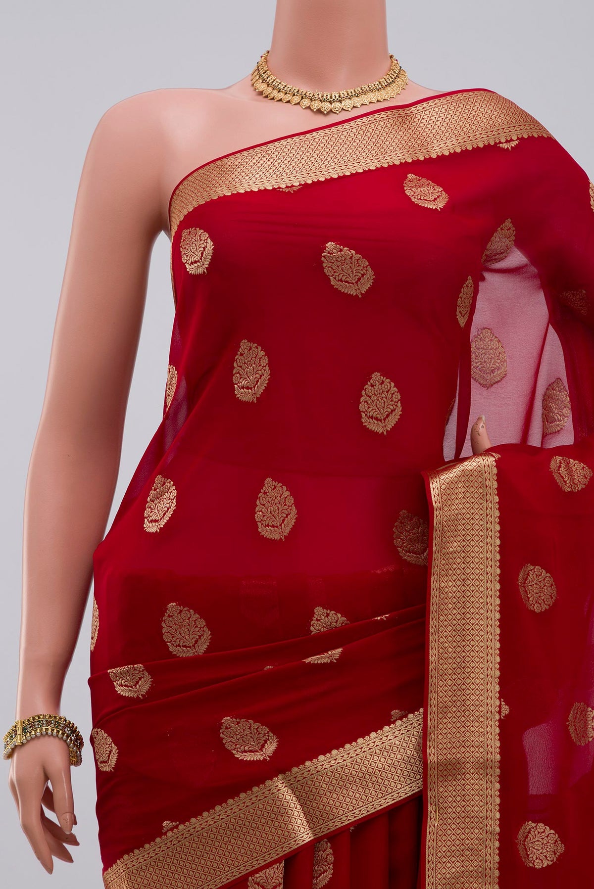 Border image of Red Georgette Saree with Fancy on the body and Zari Border. 