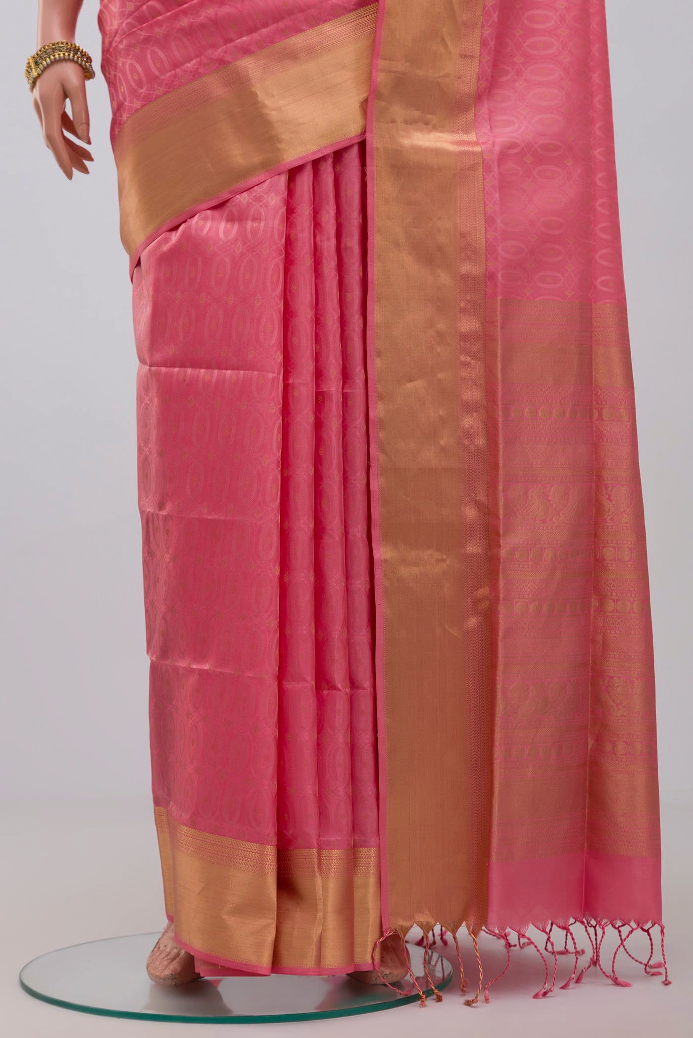 Pleats and pallu of Pink Soft Silk Saree with Jacquard With Zari Butta on the body and Zari Border. 