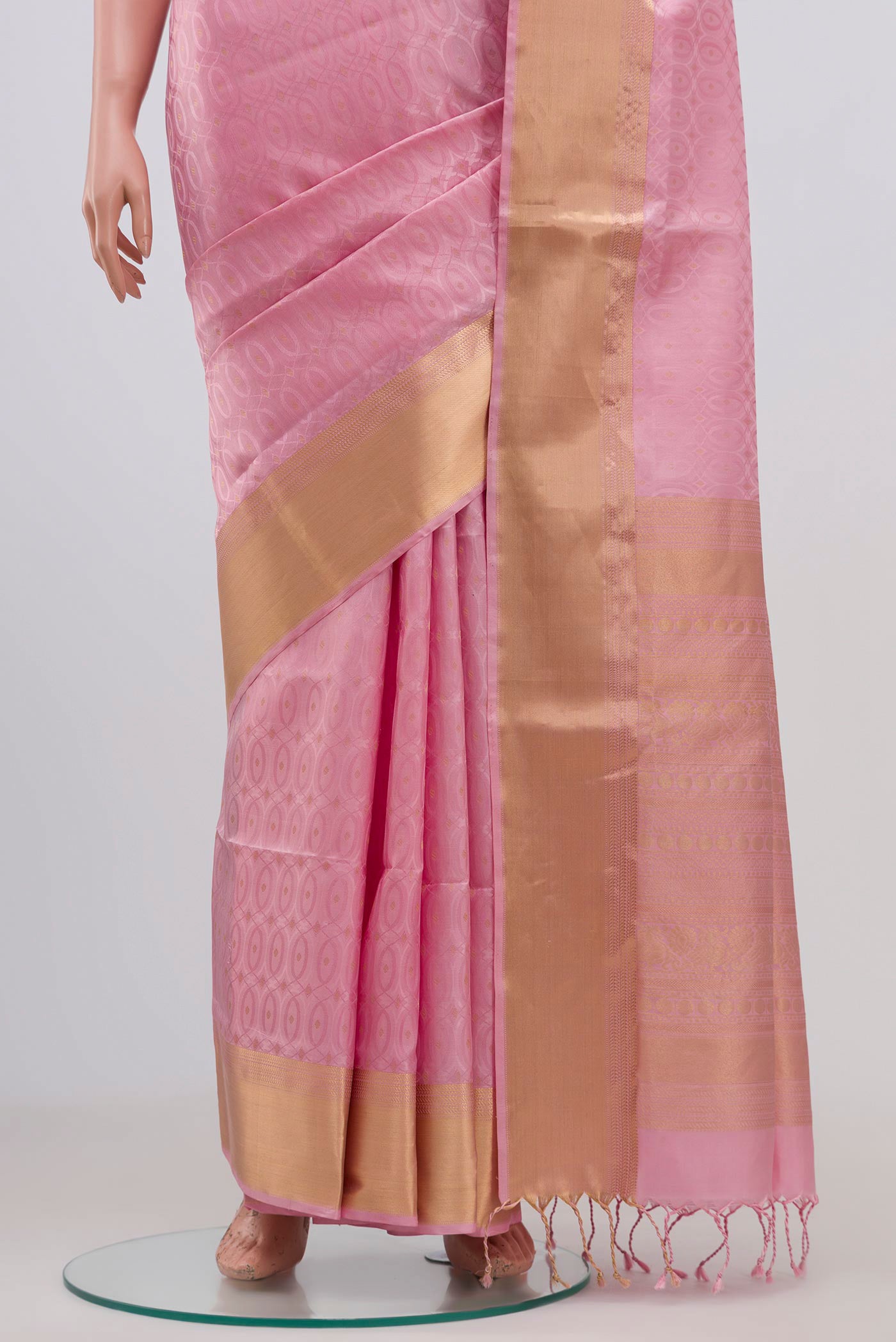 Pleats and pallu of Pink Soft Silk Saree with Jacquard With Zari Butta on the body and Zari Border. 