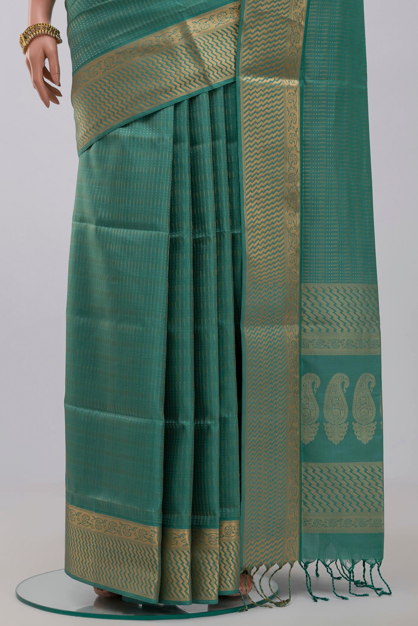 Pleats and pallu of Green Soft Silk Saree with Jacquard design on the body and Zari Border. 