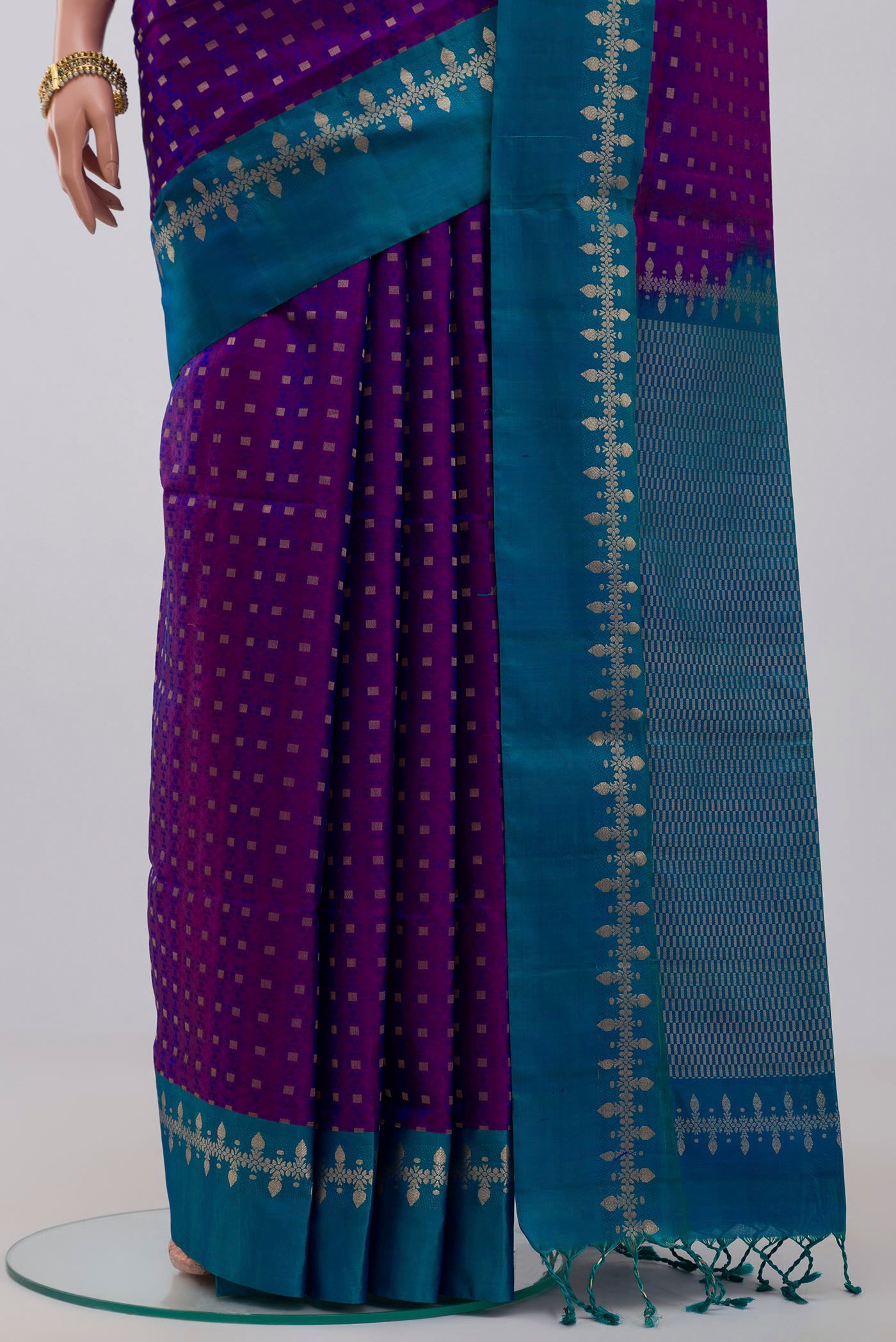 Pleats and pallu of Purple Soft Silk Saree with Jacquard With Zari Butta on the body and Zari Border. 
