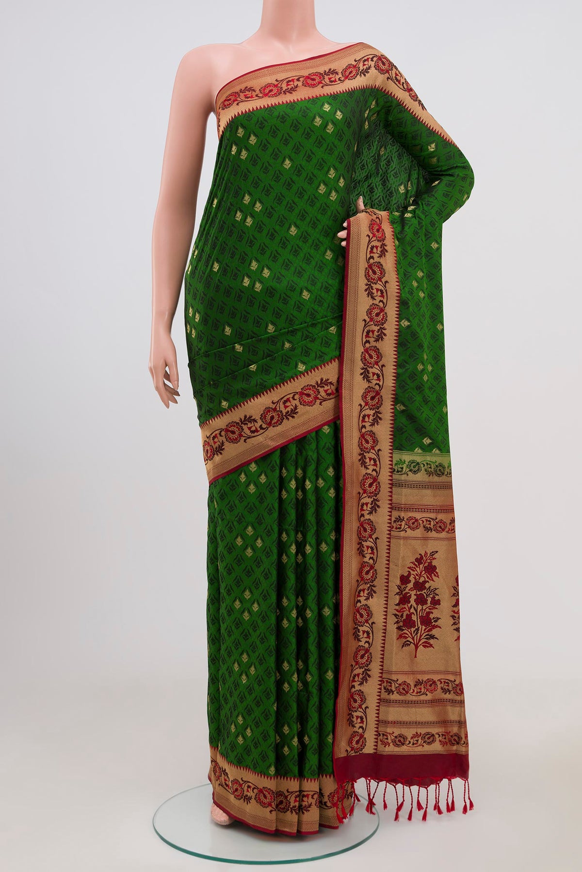 Green Soft Silk Saree with Jacquard With Zari Butta on the body and Zari Border.  displayed on a mannequin