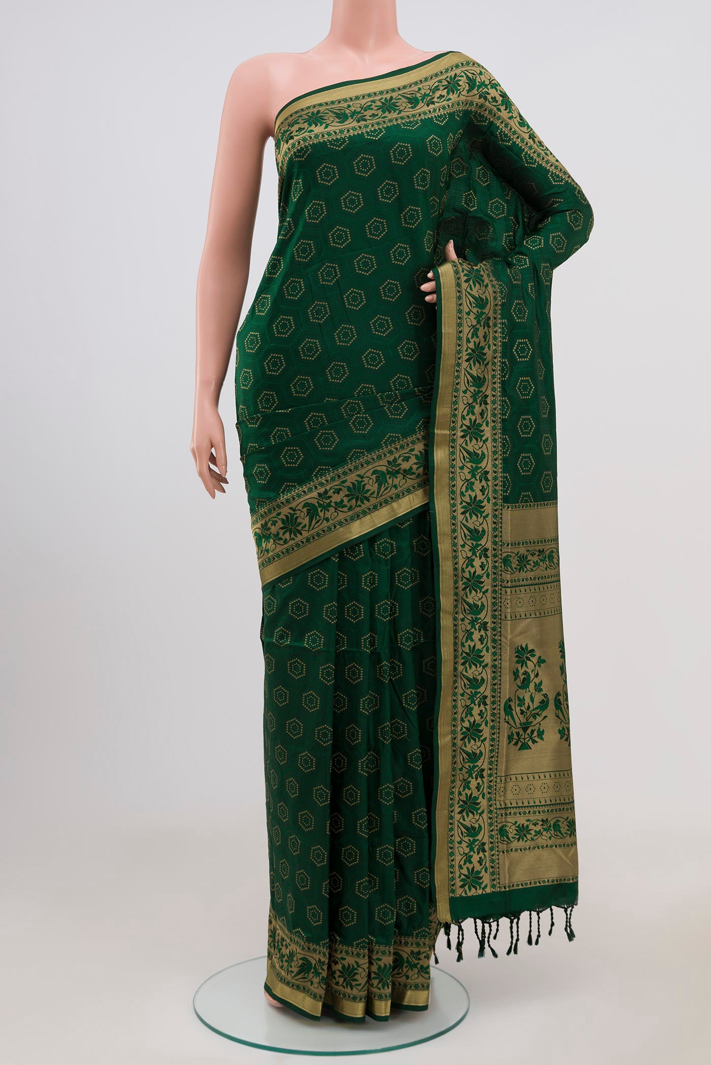 Green Soft Silk Saree with Jacquard With Zari Butta on the body and Zari Border.  displayed on a mannequin