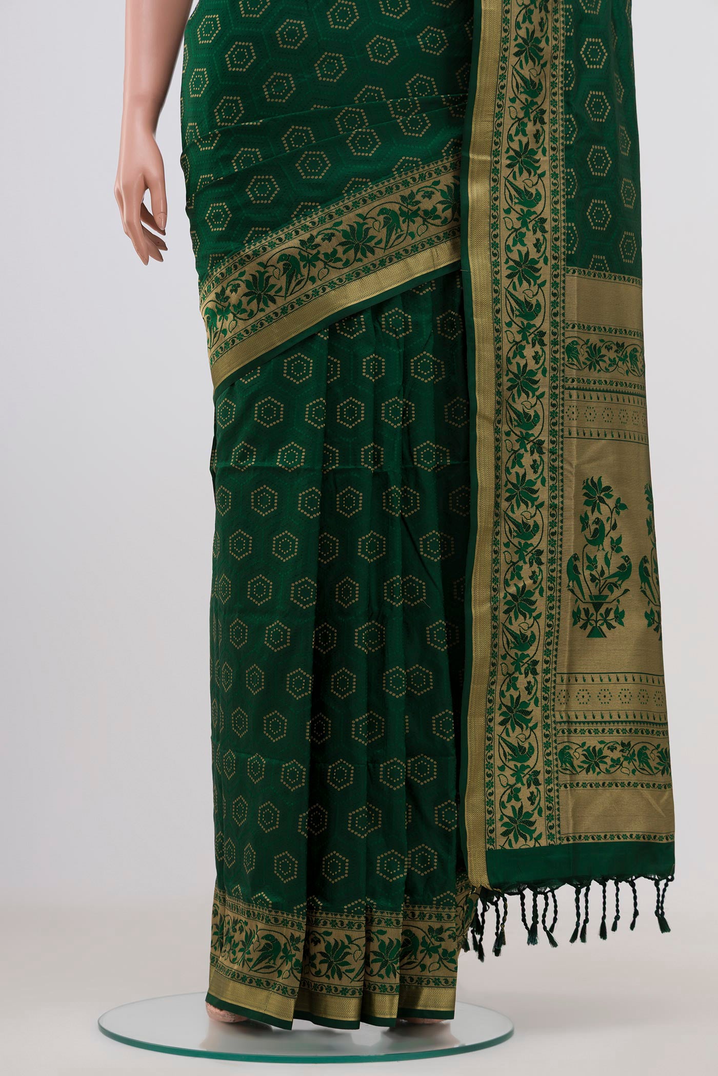 Pleats and pallu of Green Soft Silk Saree with Jacquard With Zari Butta on the body and Zari Border. 