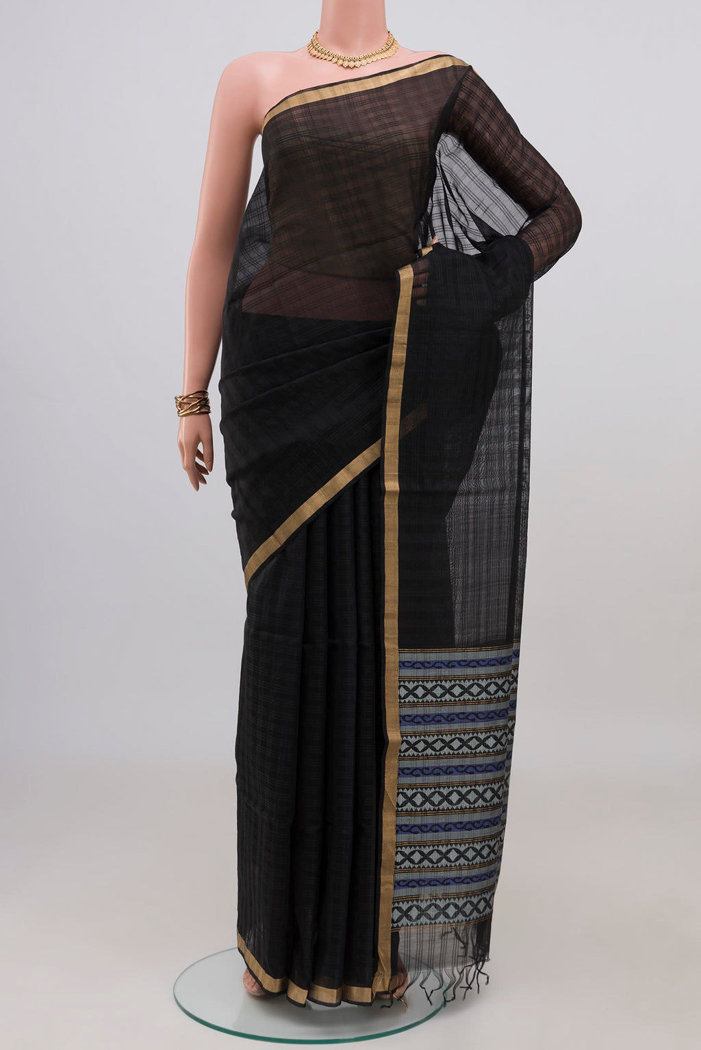 Black Silk Cotton Saree with Plain Body and Thin Zari Line.  displayed on a mannequin