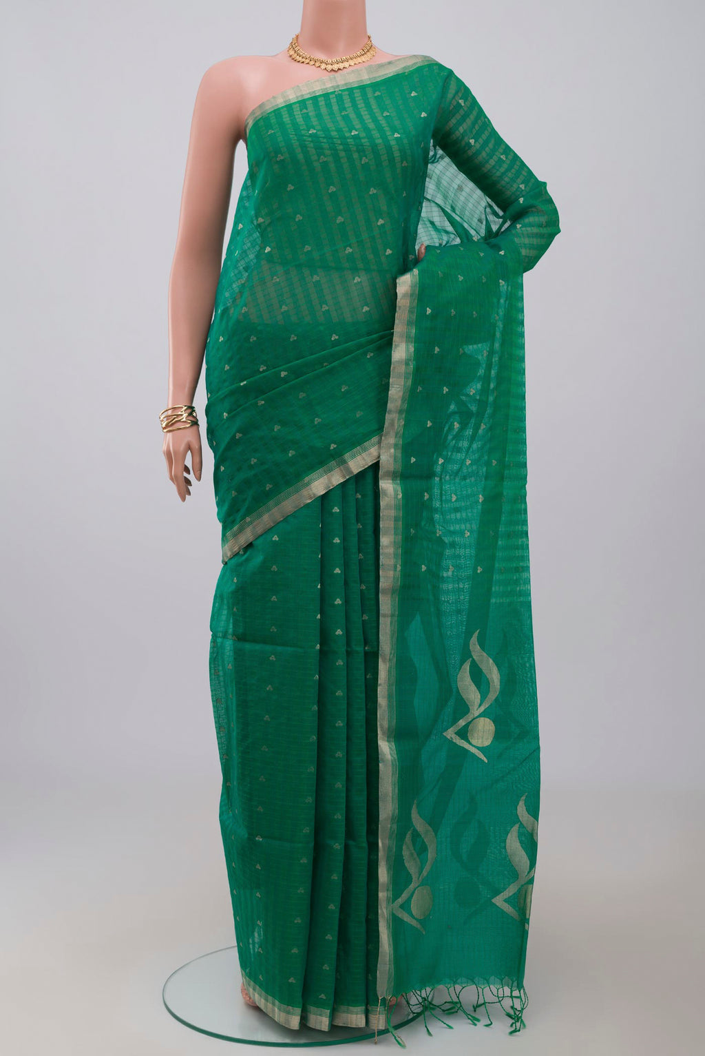 Green Silk Cotton Saree with Zari Butta on the body and Thin Zari Line.  displayed on a mannequin