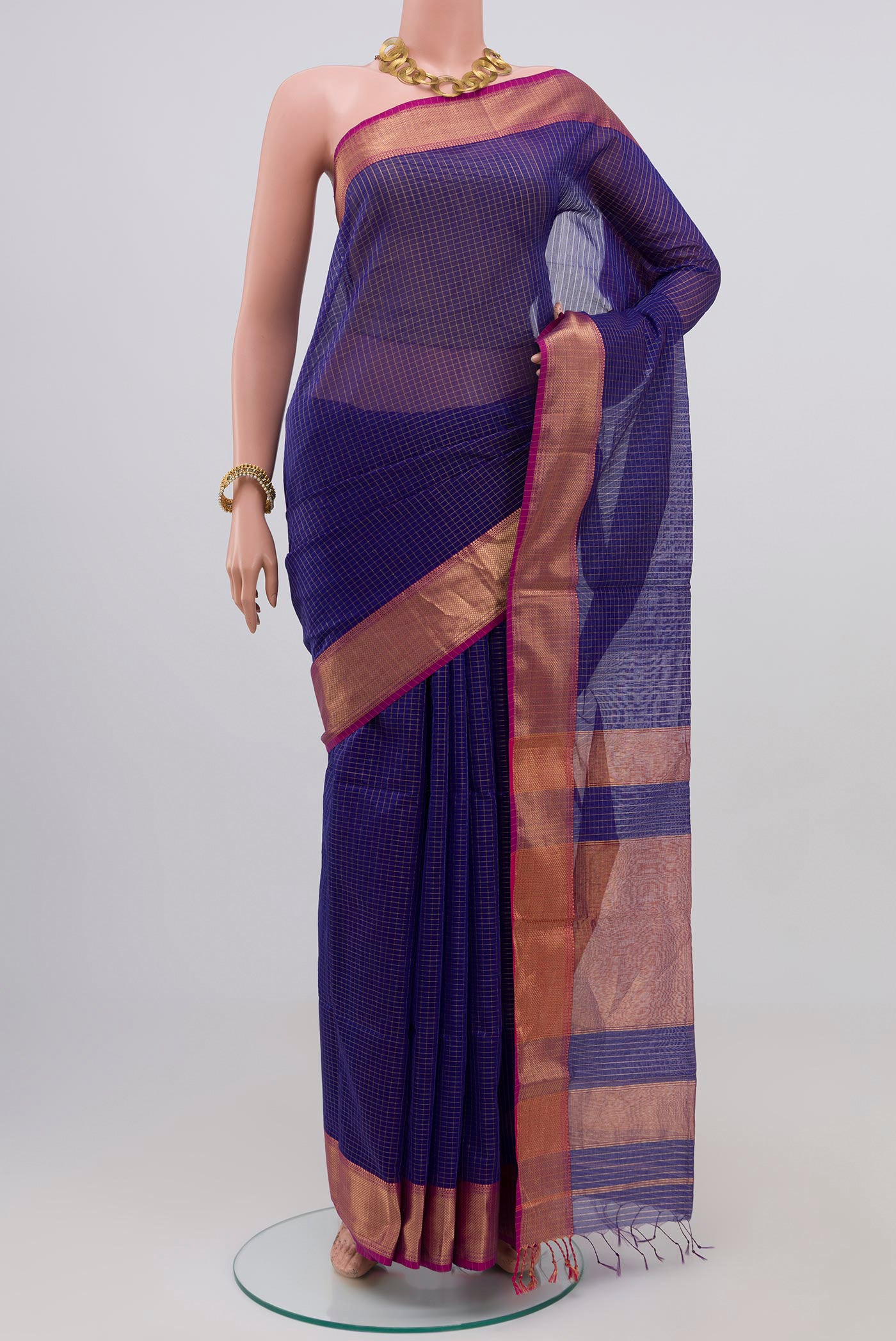 Blue Maheshwari Silk Saree with Checked design on the body and Zari Border.  displayed on a mannequin