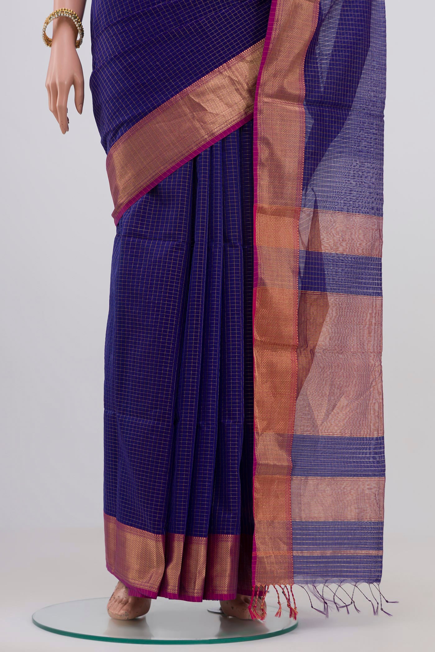 Pleats and pallu of Blue Maheshwari Silk Saree with Checked design on the body and Zari Border. 