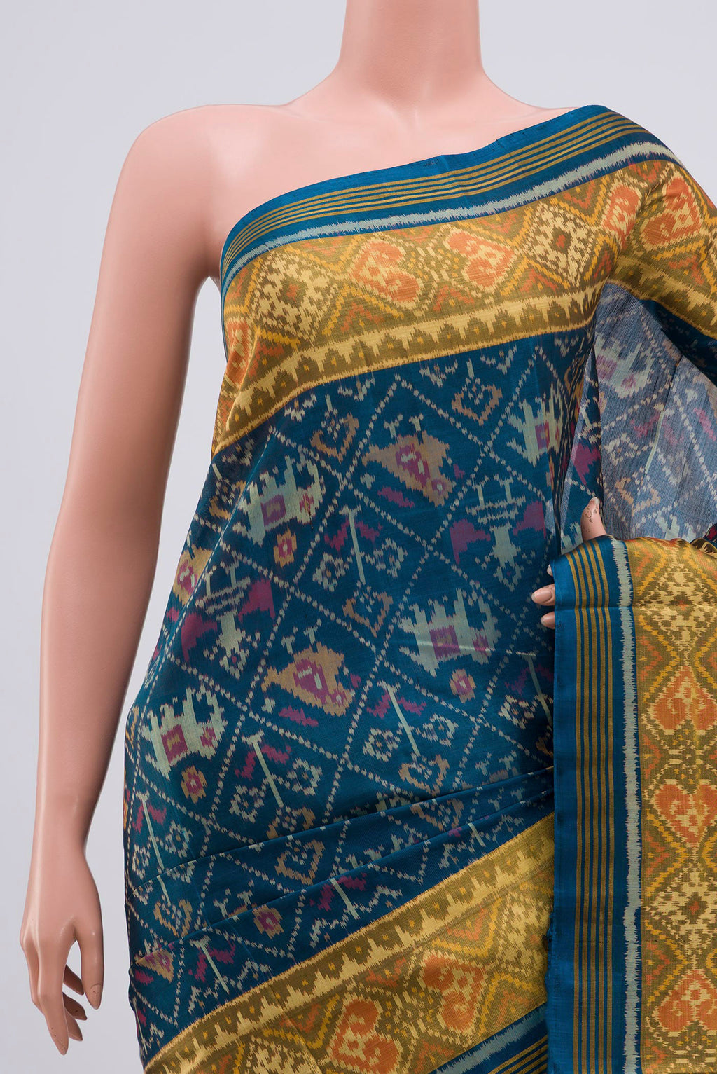 Border image of Maya Blue Rajkot Patola Silk Saree with Ikat design on the body and Zari Border. 