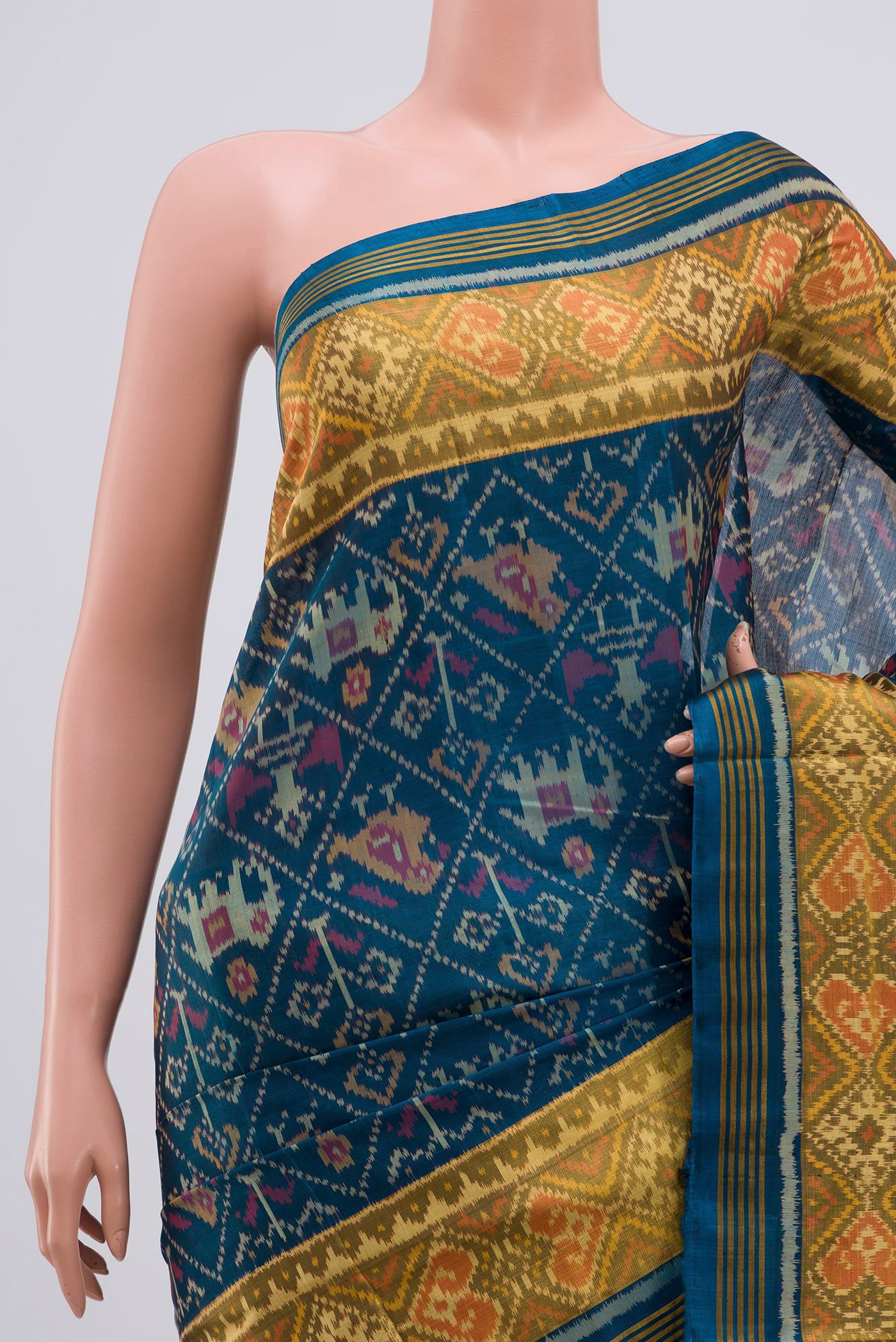 Border image of Maya Blue Rajkot Patola Silk Saree with Ikat design on the body and Zari Border. 