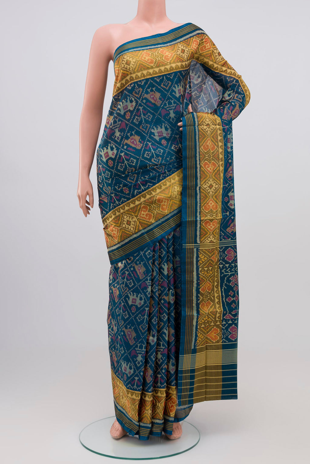 Maya Blue Rajkot Patola Silk Saree with Ikat design on the body and Zari Border.  displayed on a mannequin