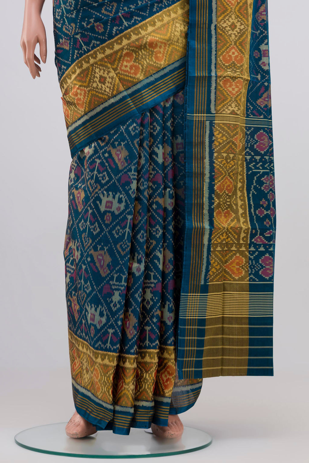 Pleats and pallu of Maya Blue Rajkot Patola Silk Saree with Ikat design on the body and Zari Border. 