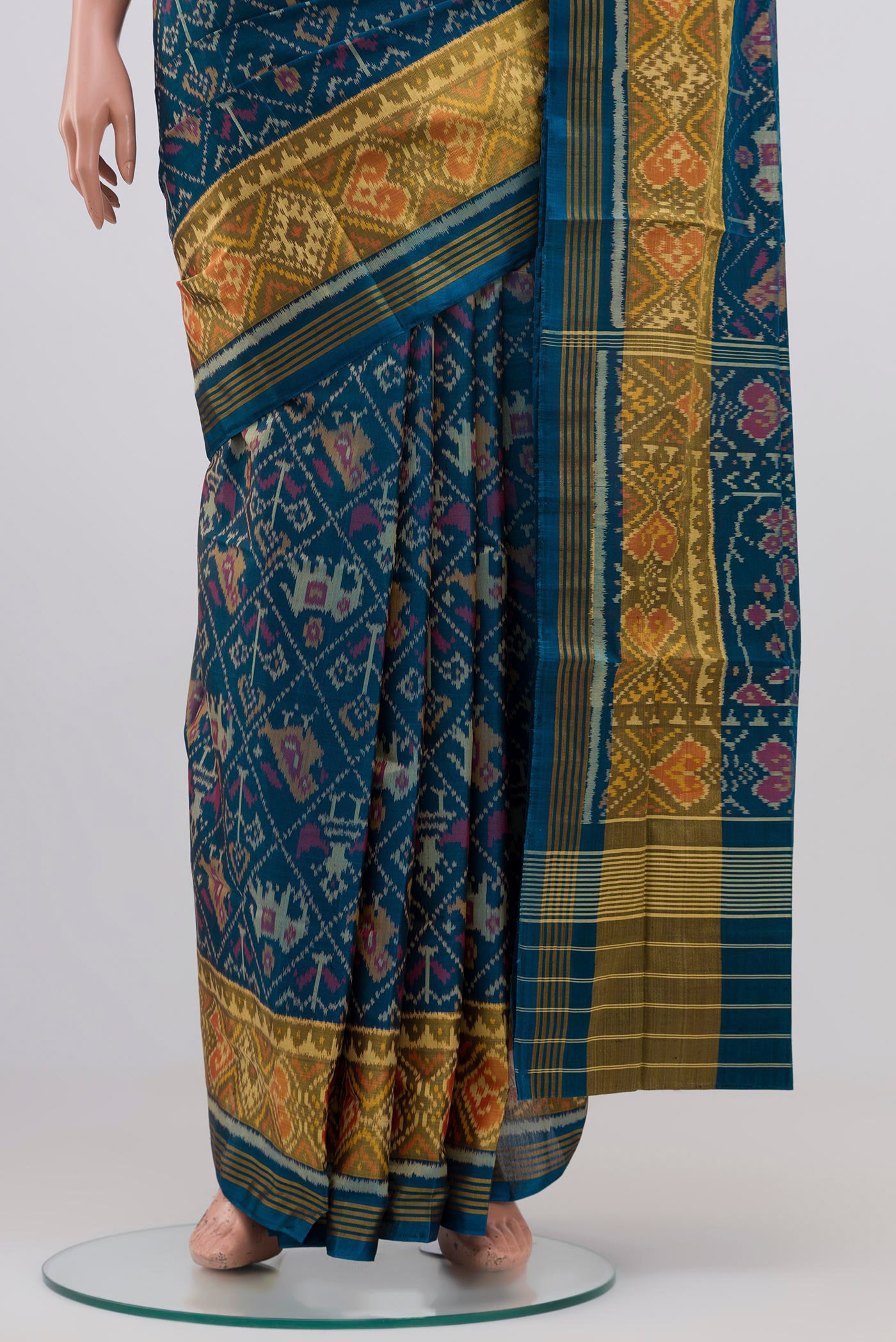 Pleats and pallu of Maya Blue Rajkot Patola Silk Saree with Ikat design on the body and Zari Border. 