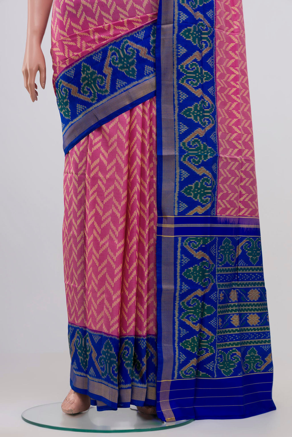 Pleats and pallu of Pink Rajkot Patola Silk Saree with Ikat design on the body and Zari Border. 