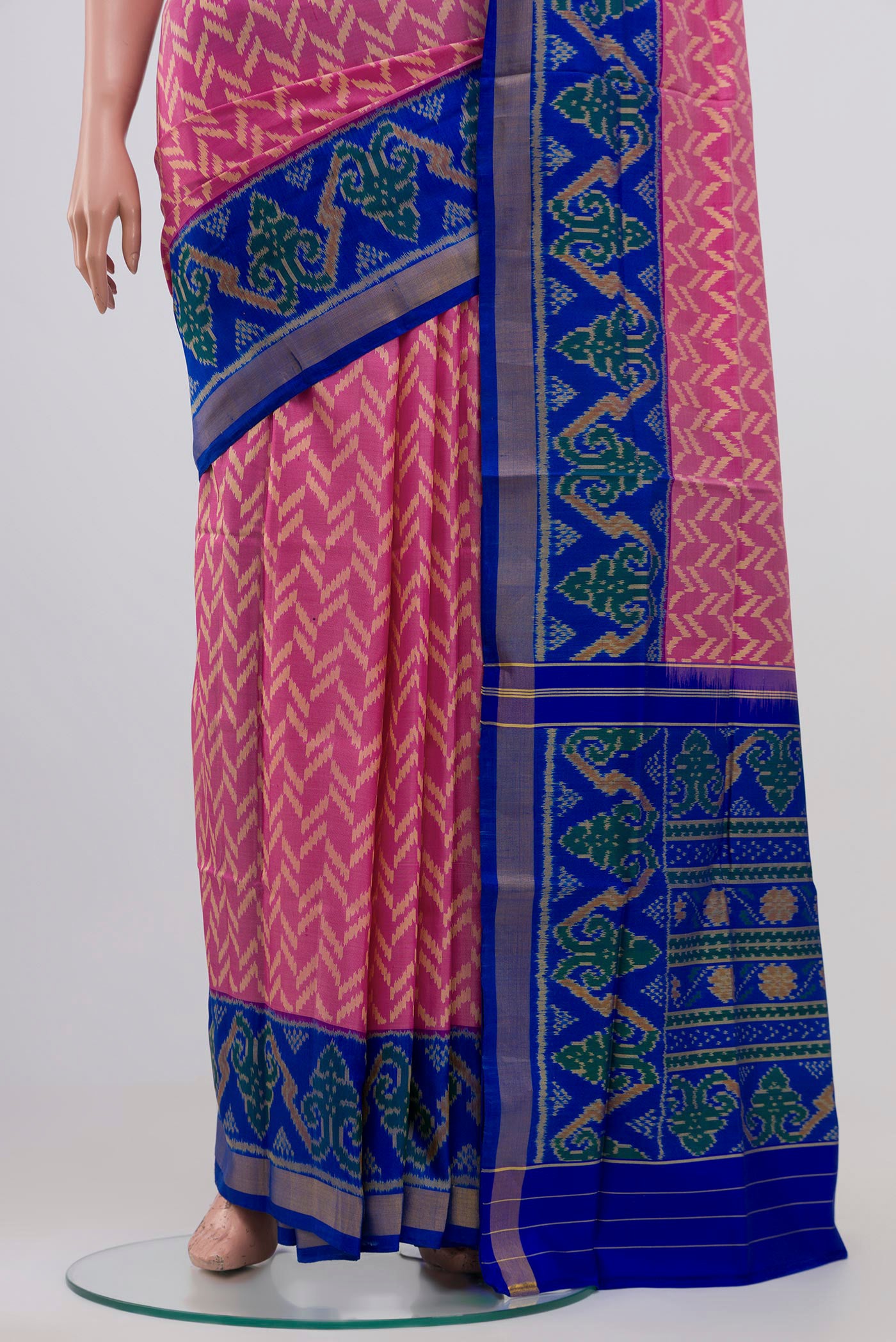 Pleats and pallu of Pink Rajkot Patola Silk Saree with Ikat design on the body and Zari Border. 