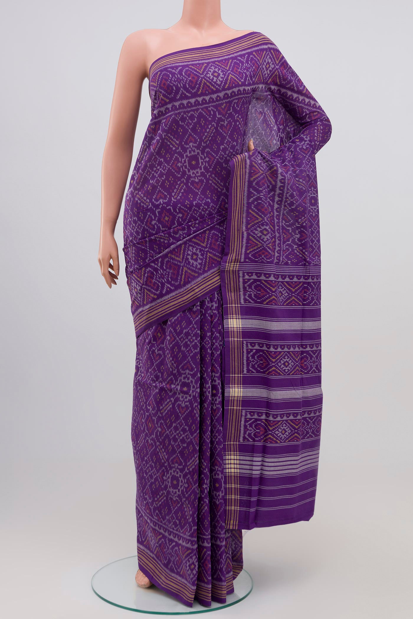 Purple Double Ikat Saree with Ikat design on the body and Plain Border.  displayed on a mannequin