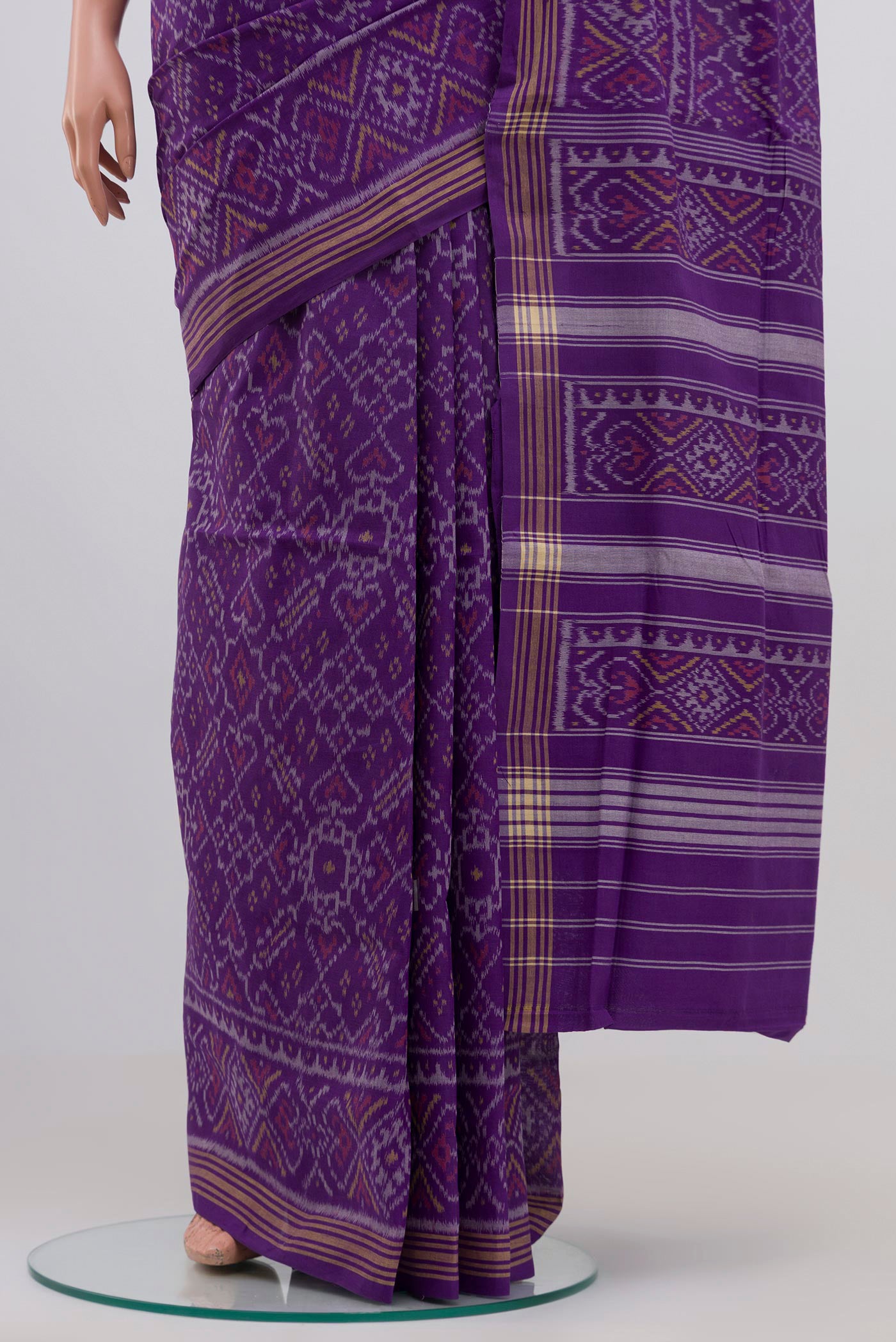 Pleats and pallu of Purple Double Ikat Saree with Ikat design on the body and Plain Border. 