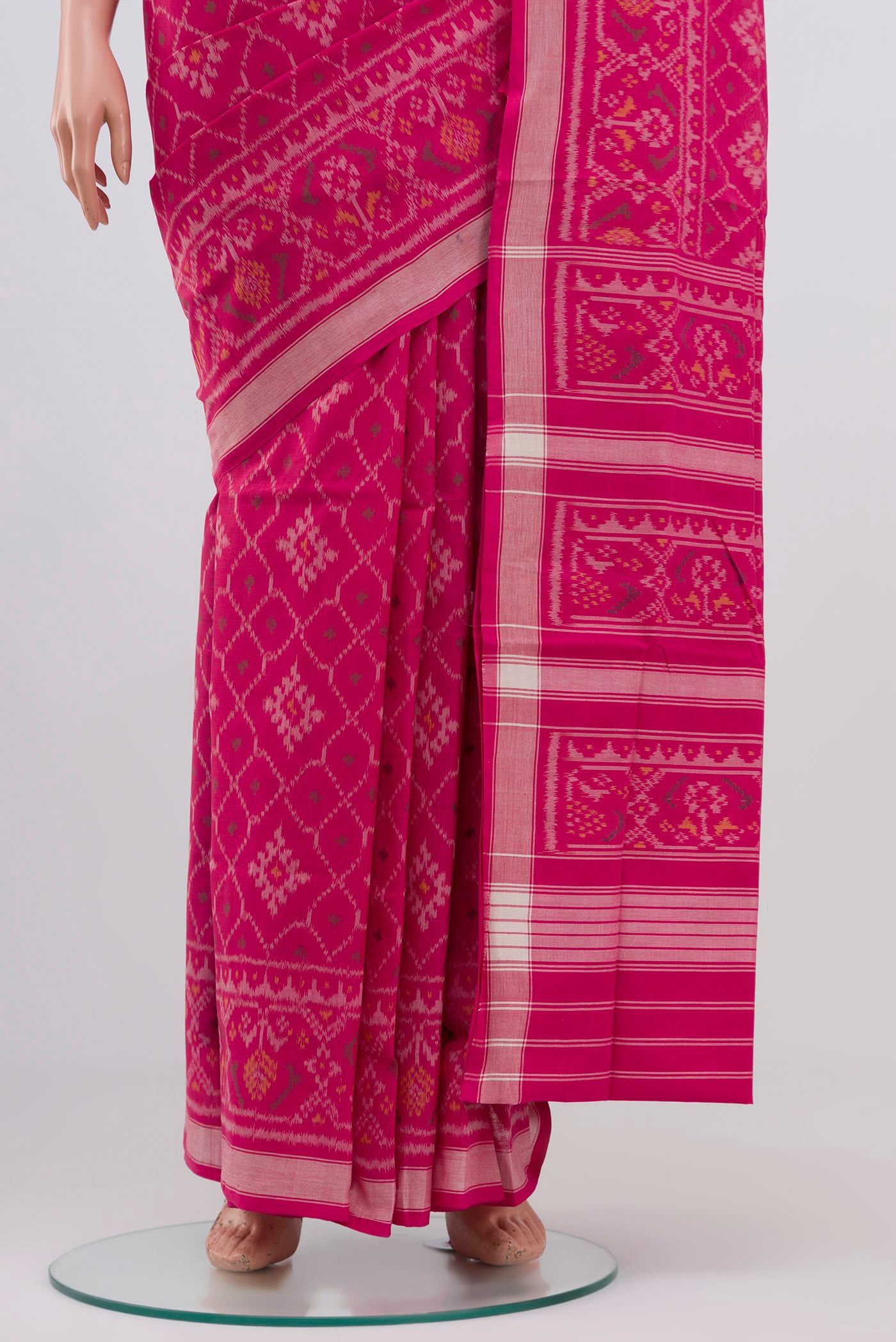 Pleats and pallu of Pink Double Ikat Saree with Ikat design on the body and Plain Border. 