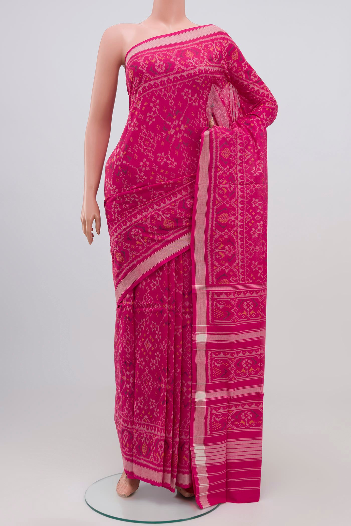 Pink Pochampally Silk Saree with Ikat Print on the body and Ikat Border.  displayed on a mannequin