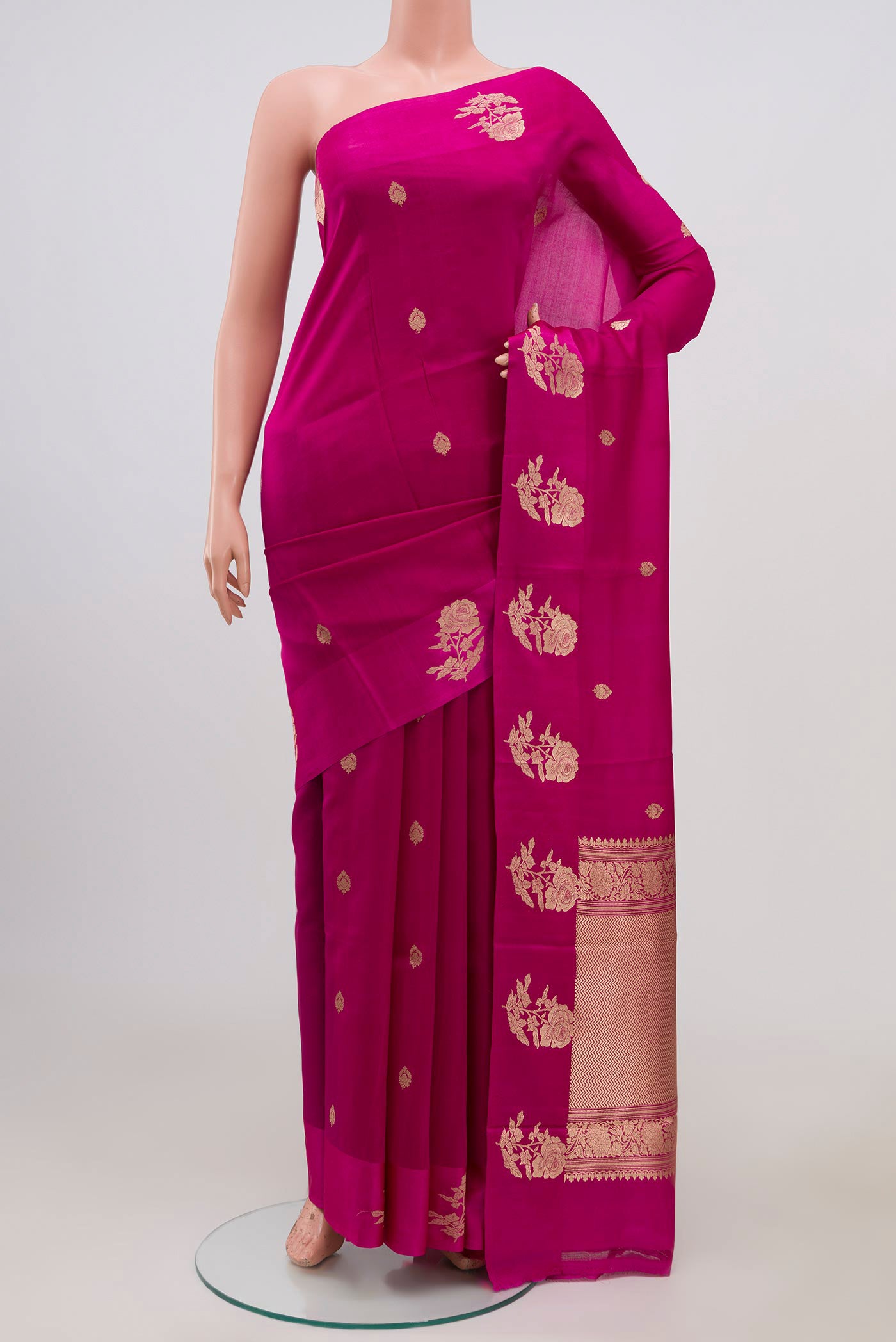 Pink Banarasi Katan Silk Saree with Zari Butta on the body and Fancy Border.  displayed on a mannequin