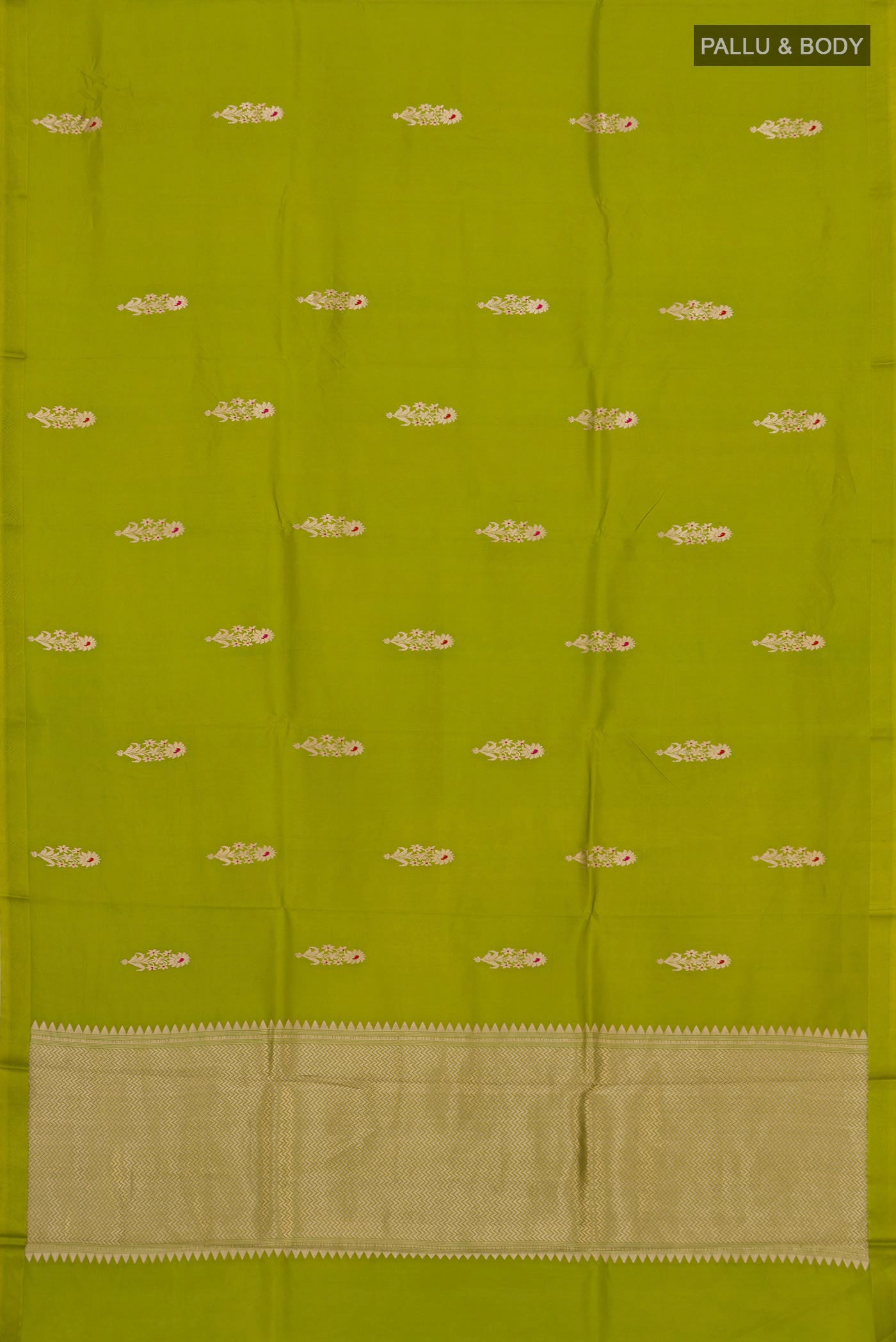 Flat view of Parrot Green Banarasi Katan Silk Saree with Zari Butta on the body and Zari Border. 