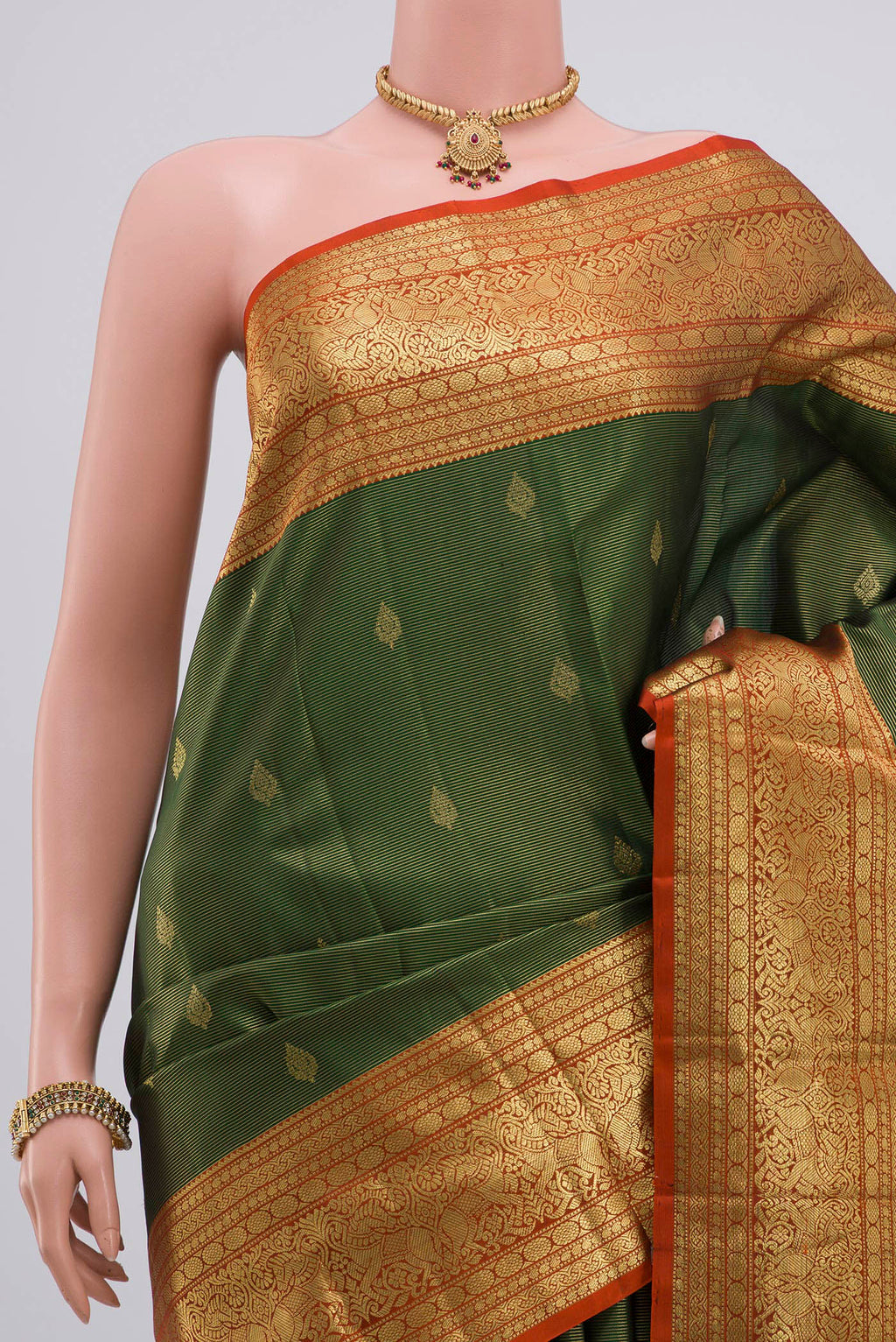 Border image of Green Kanjivaram Silk Saree with Zari Butta on the body and Zari Border. 