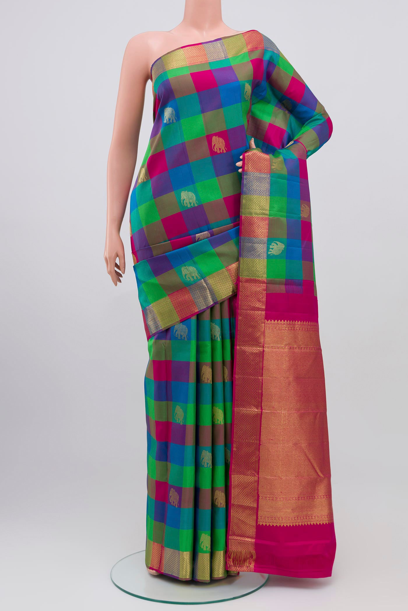 Multi Color Kanjivaram Saree with Checked design on the body and Zari Border.  displayed on a mannequin