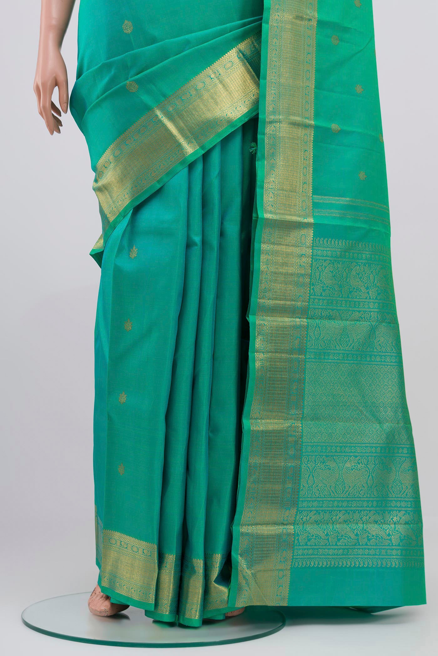 Pleats and pallu of Pure Silk Pure Zari Green Kanjivaram Saree with Zari Butta on the body and Zari Border. 