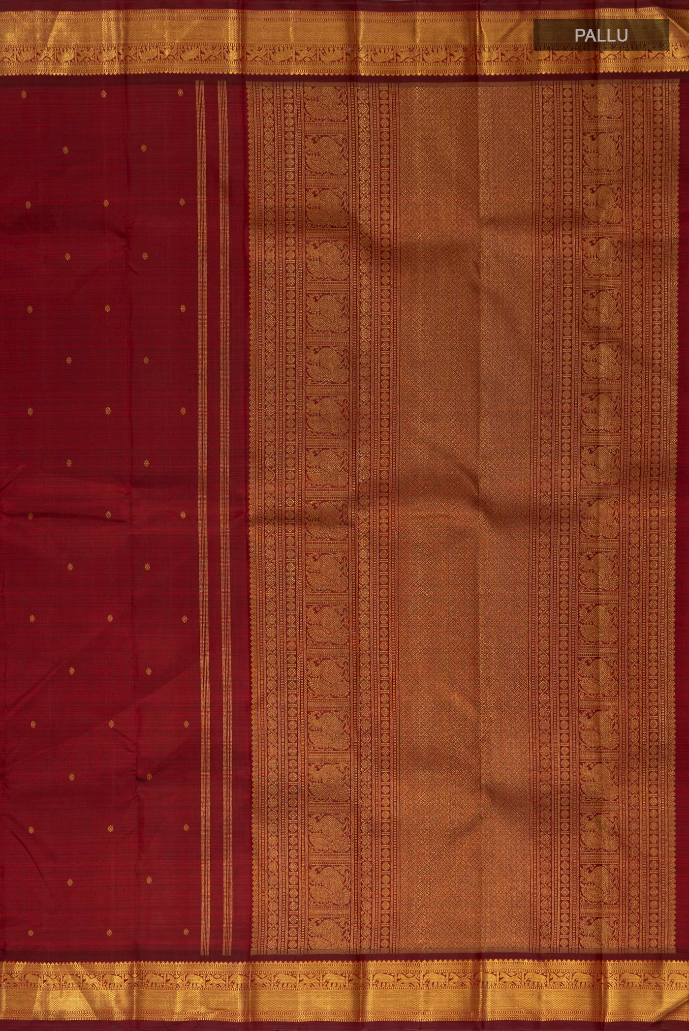 Close up image of the pallu of Pure Silk Pure Zari Maroon Kanchipuram Saree with Zari Butta on the body and Zari Border. 