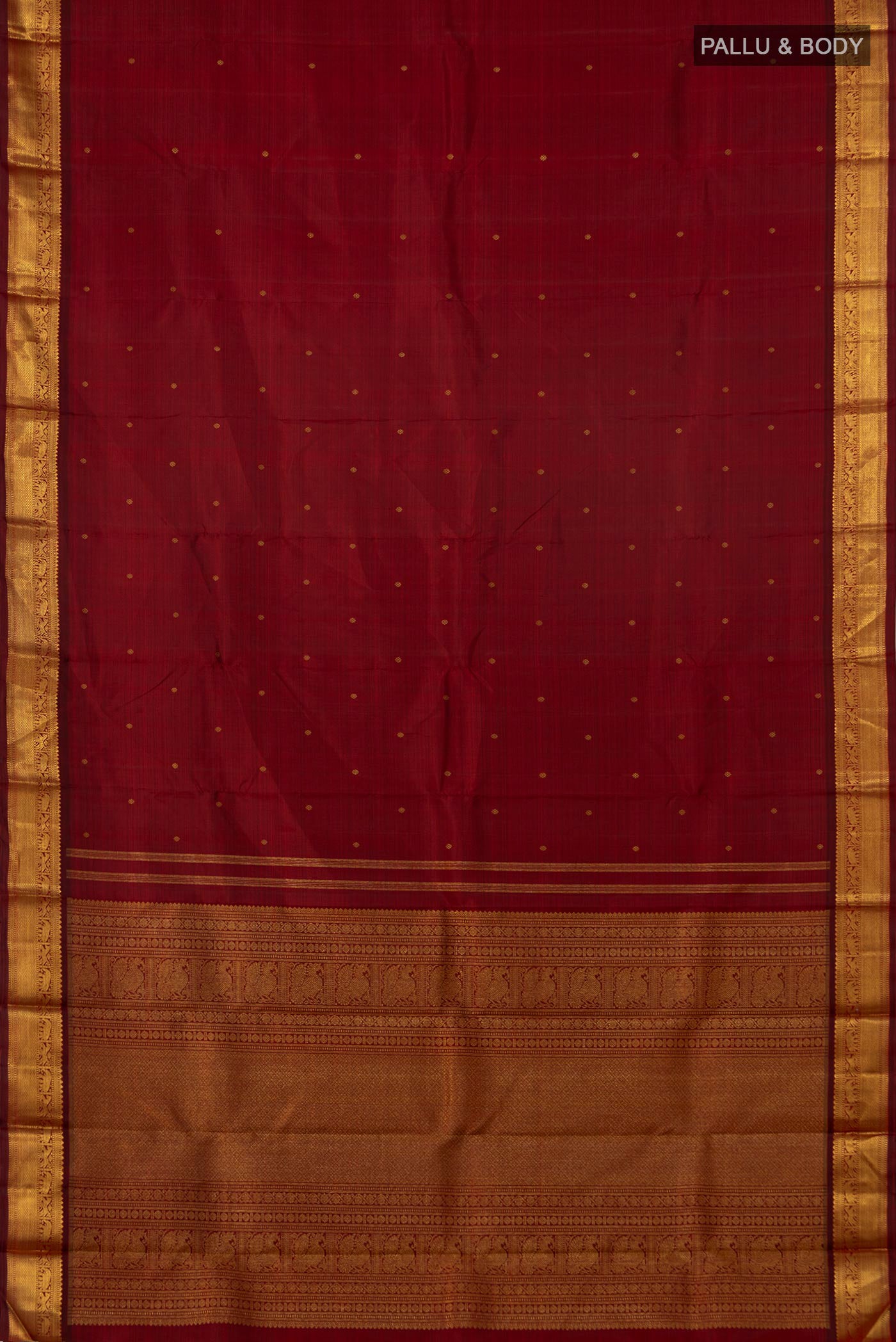 Flat view of Pure Silk Pure Zari Maroon Kanchipuram Saree with Zari Butta on the body and Zari Border. 