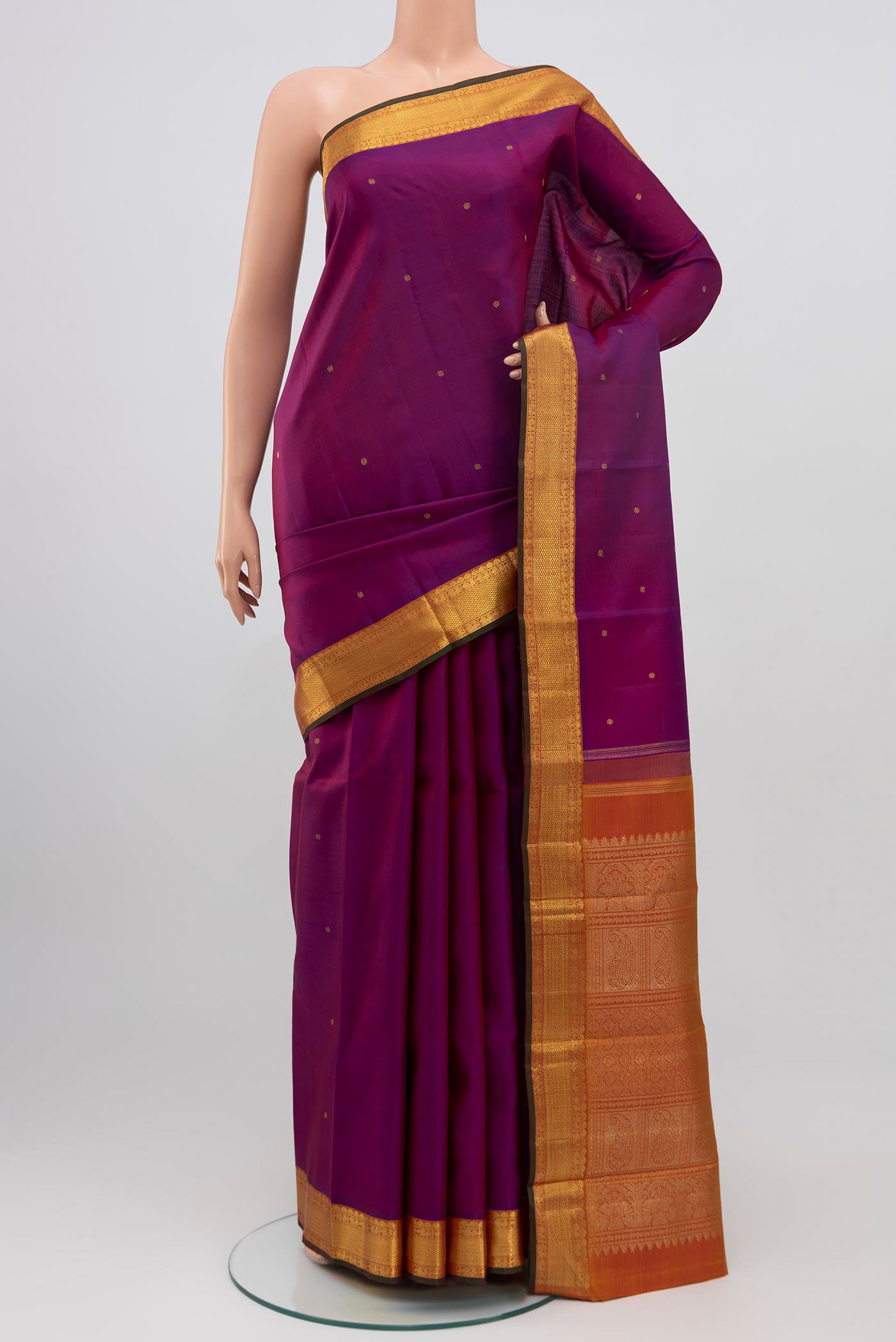 Pure Silk Pure Zari Purple Kanjivaram Saree with Zari Butta on the body and Zari Border.  displayed on a mannequin