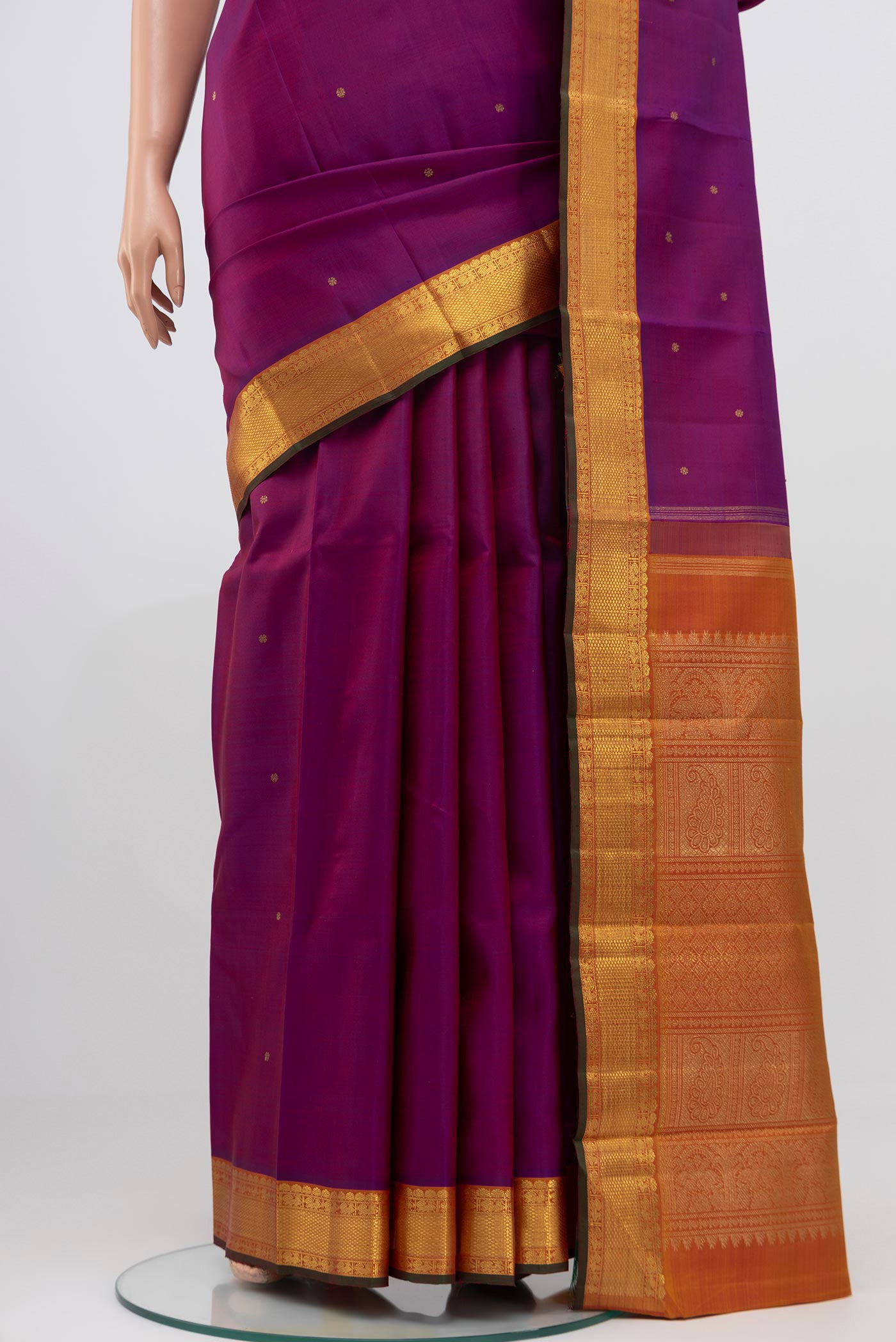 Pleats and pallu of Pure Silk Pure Zari Purple Kanjivaram Saree with Zari Butta on the body and Zari Border. 