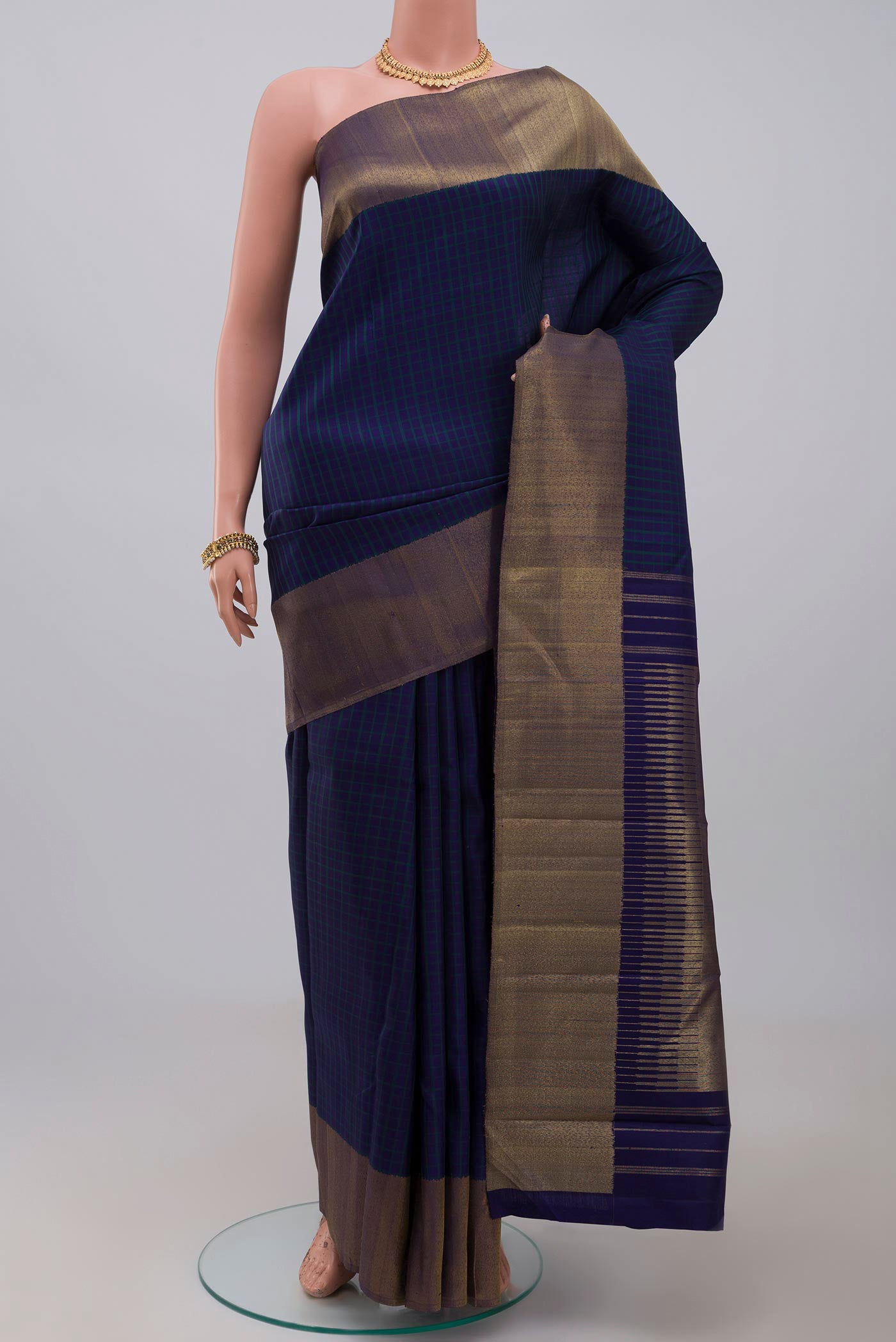Pure Silk Pure Zari Blue Kanjivaram Saree with Checked design on the body and Zari Border.  displayed on a mannequin