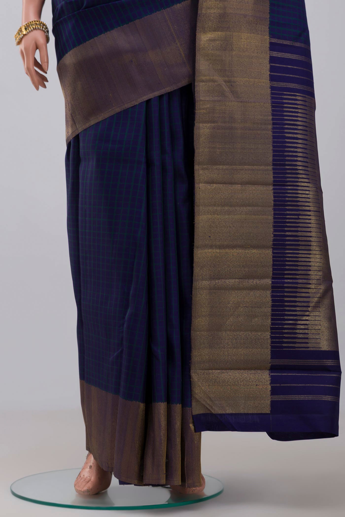 Pleats and pallu of Pure Silk Pure Zari Blue Kanjivaram Saree with Checked design on the body and Zari Border. 