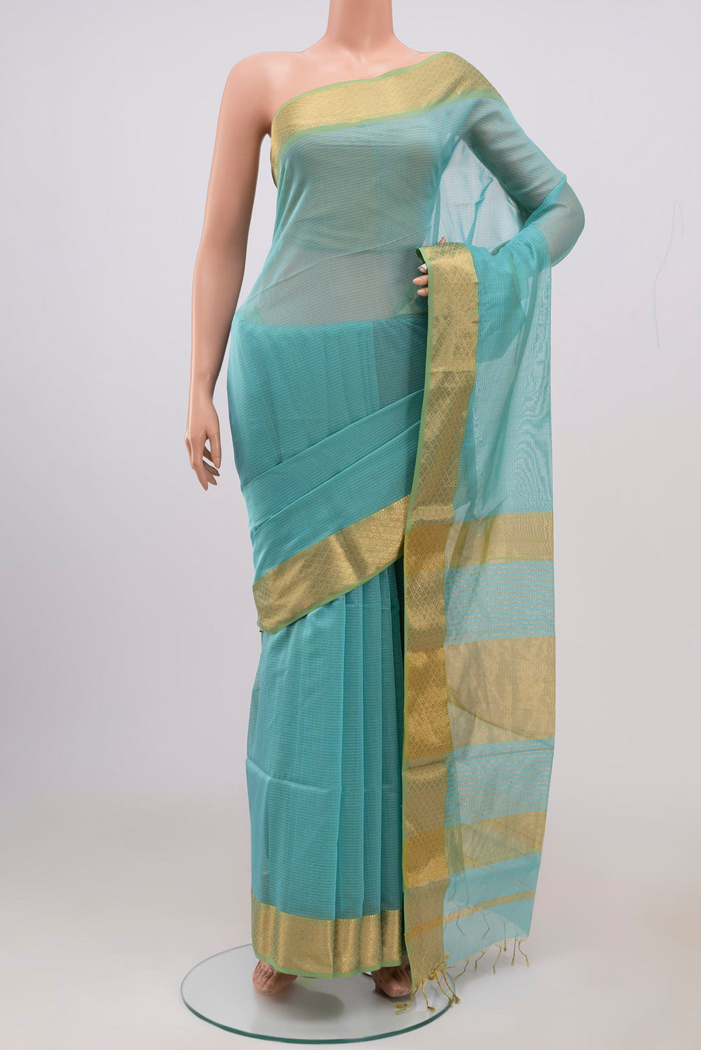 Sky Blue Maheshwari Silk Cotton Saree with Plain Body and Zari Border.  displayed on a mannequin