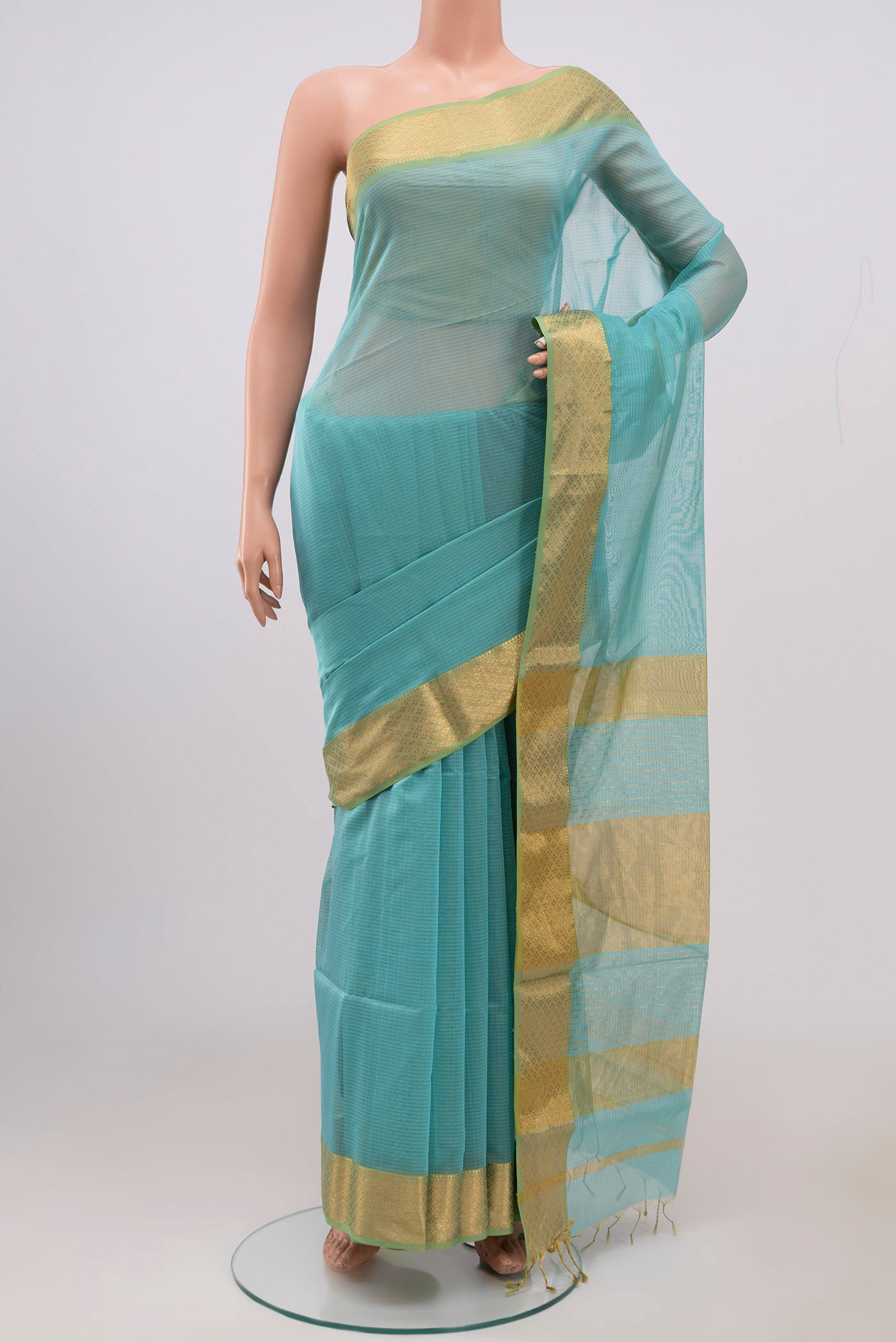 Sky Blue Maheshwari Silk Cotton Saree with Plain Body and Zari Border.  displayed on a mannequin