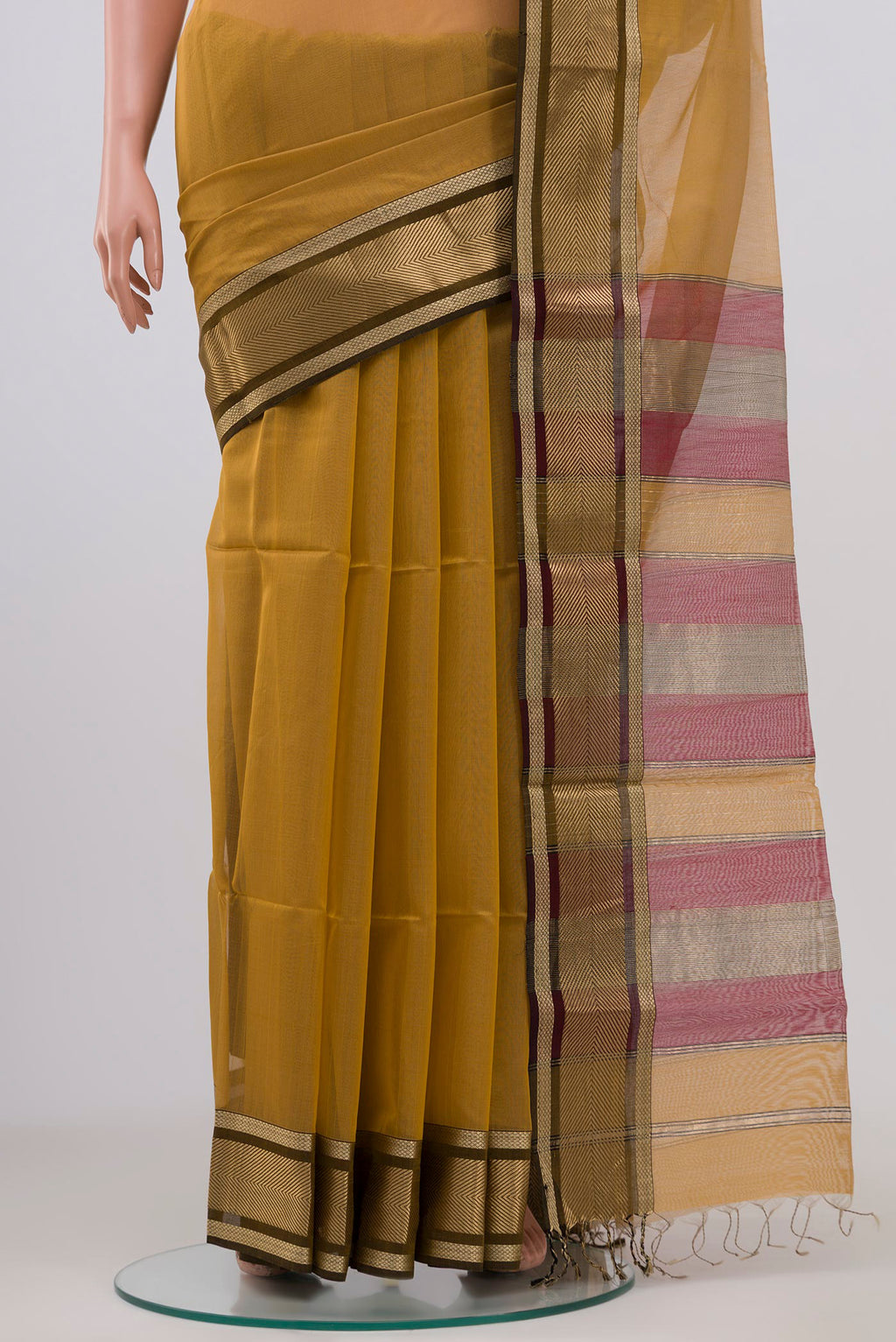 Pleats and pallu of Beige Maheshwari Silk Cotton Saree with Plain Body and Zari Border. 