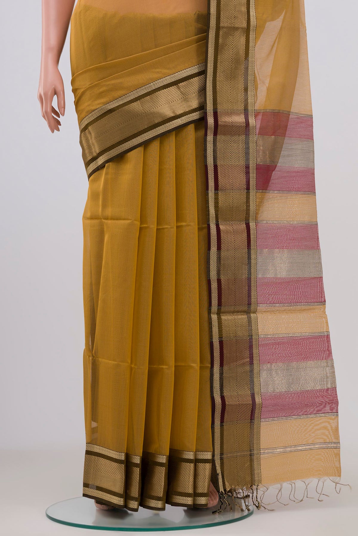 Pleats and pallu of Beige Maheshwari Silk Cotton Saree with Plain Body and Zari Border. 