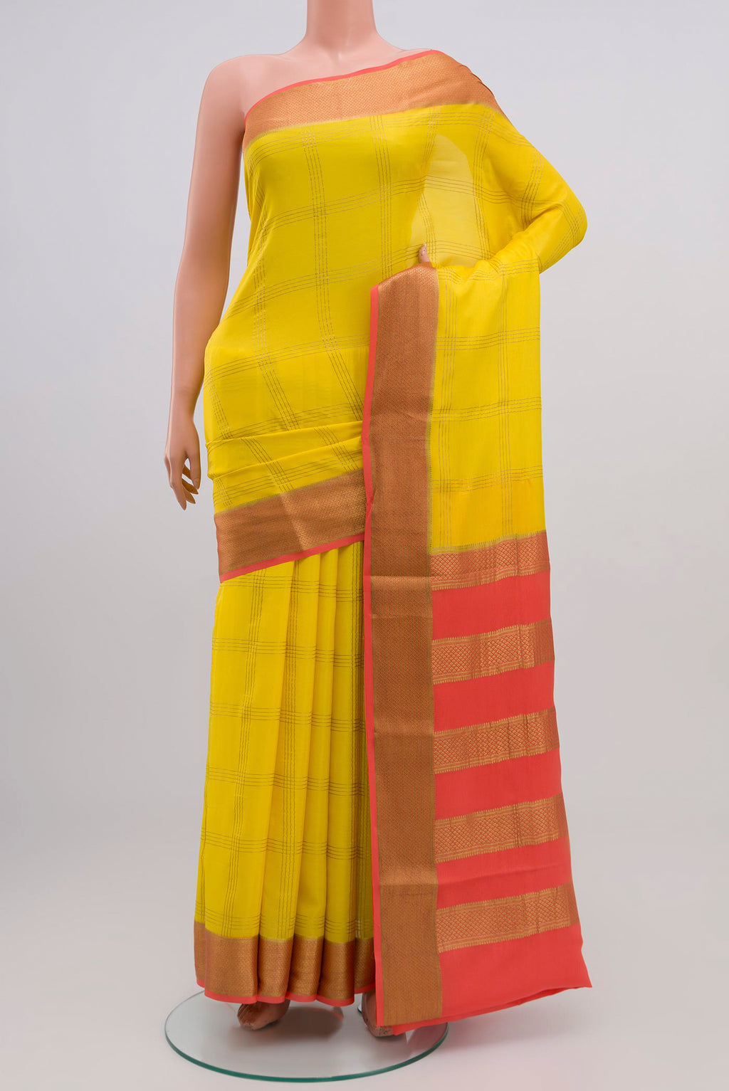 Yellow Crepe Saree with Checked design on the body and Zari Border.  displayed on a mannequin