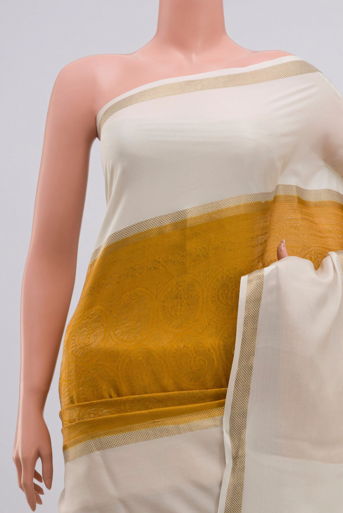 Border image of Mustard Mysore Crepe Saree with Zari Brocade on the body and Zari Border. 