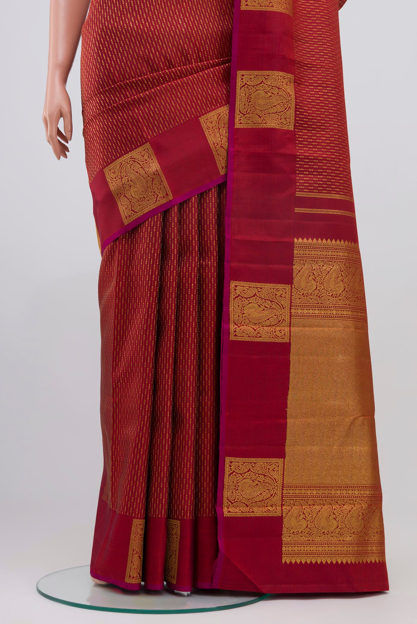 Pleats and pallu of Maroon Kanjivaram Saree with Stripes on the body and Fancy Border. 
