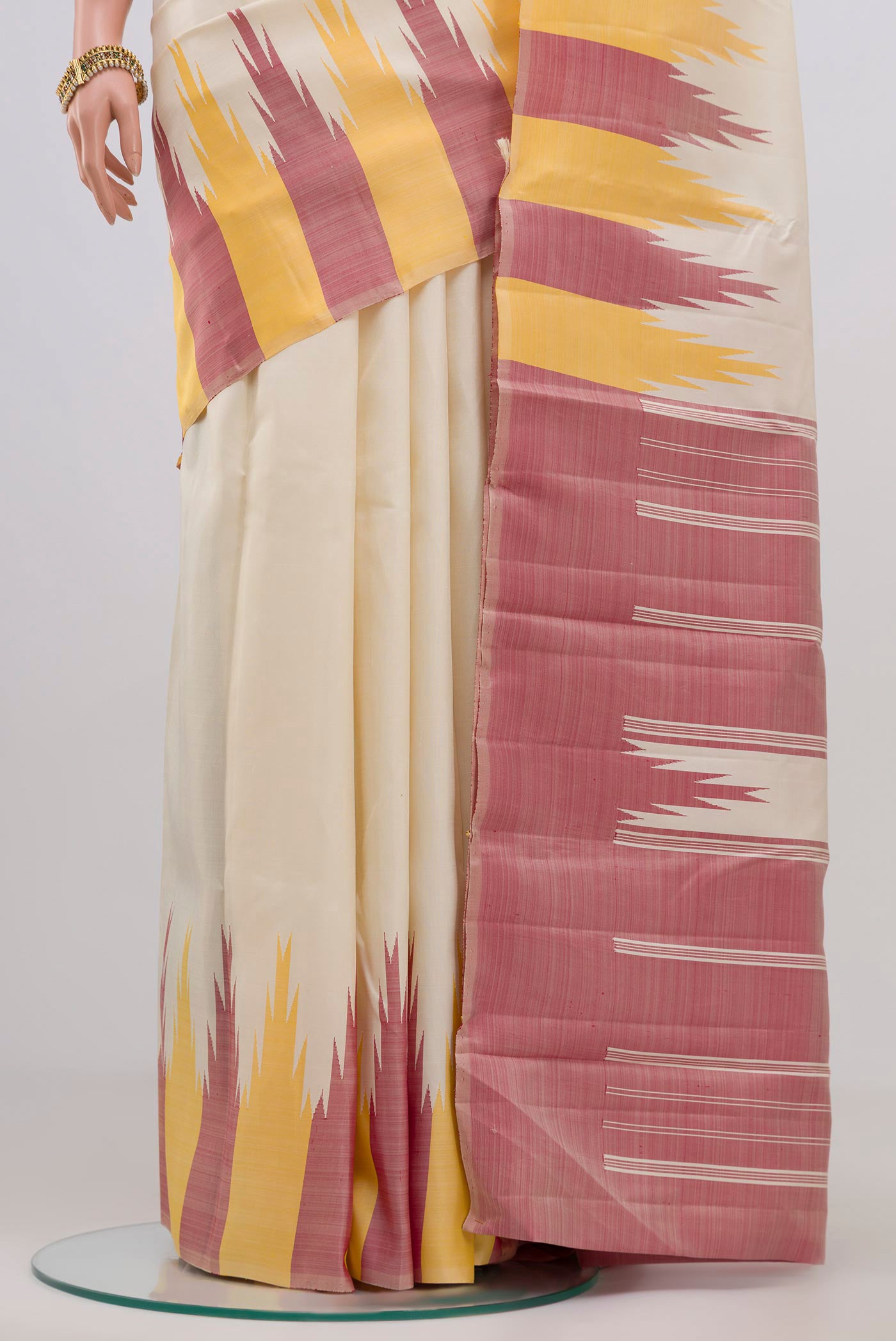 Pleats and pallu of Off White Kanchipuram Silk Saree with Plain Body and Temple Border. 